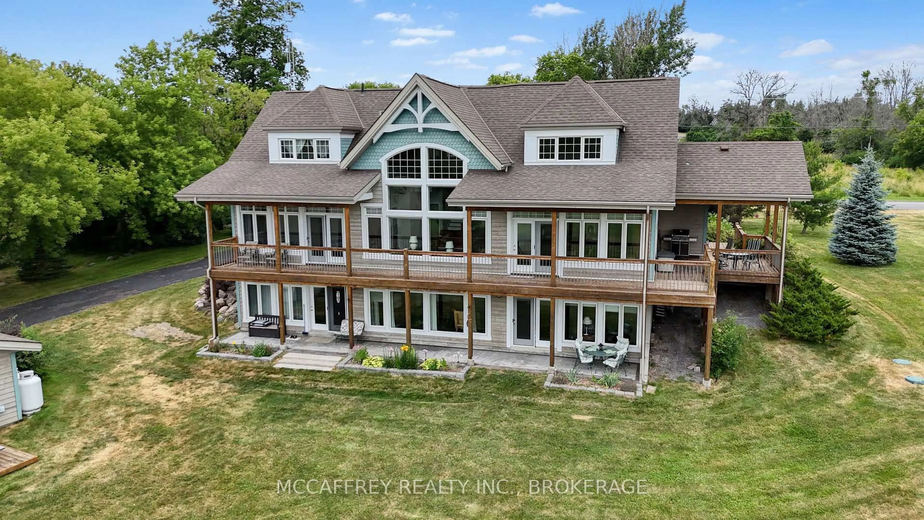 A pic from outside/outdoor area/front of a property/back of a property/a pic from drone, water/lake/river/ocean view for 6019 County Road 9, Napanee Ontario K7R 3K8