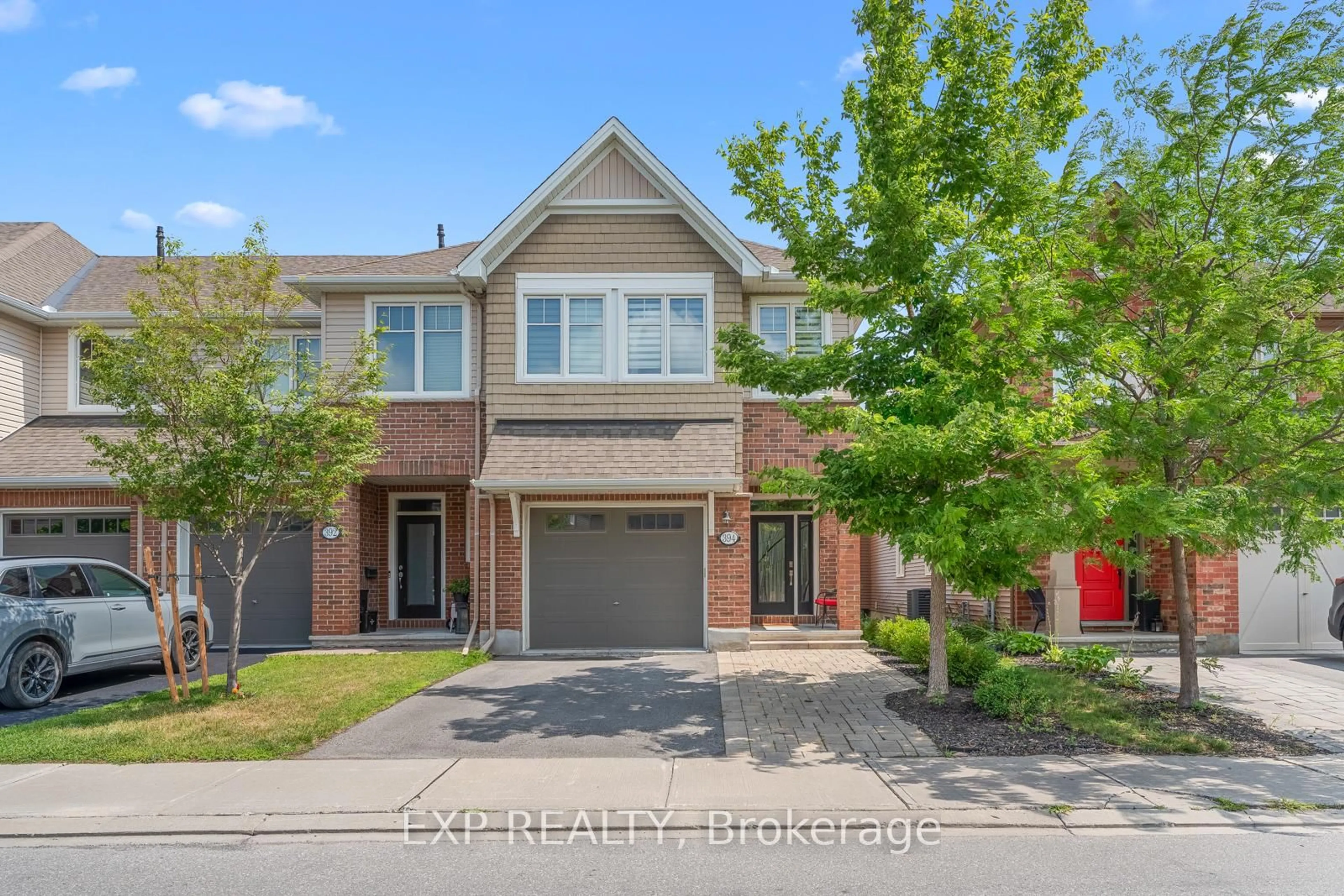 Home with brick exterior material, street for 394 WARMSTONE Dr, Ottawa Ontario K2S 1B9