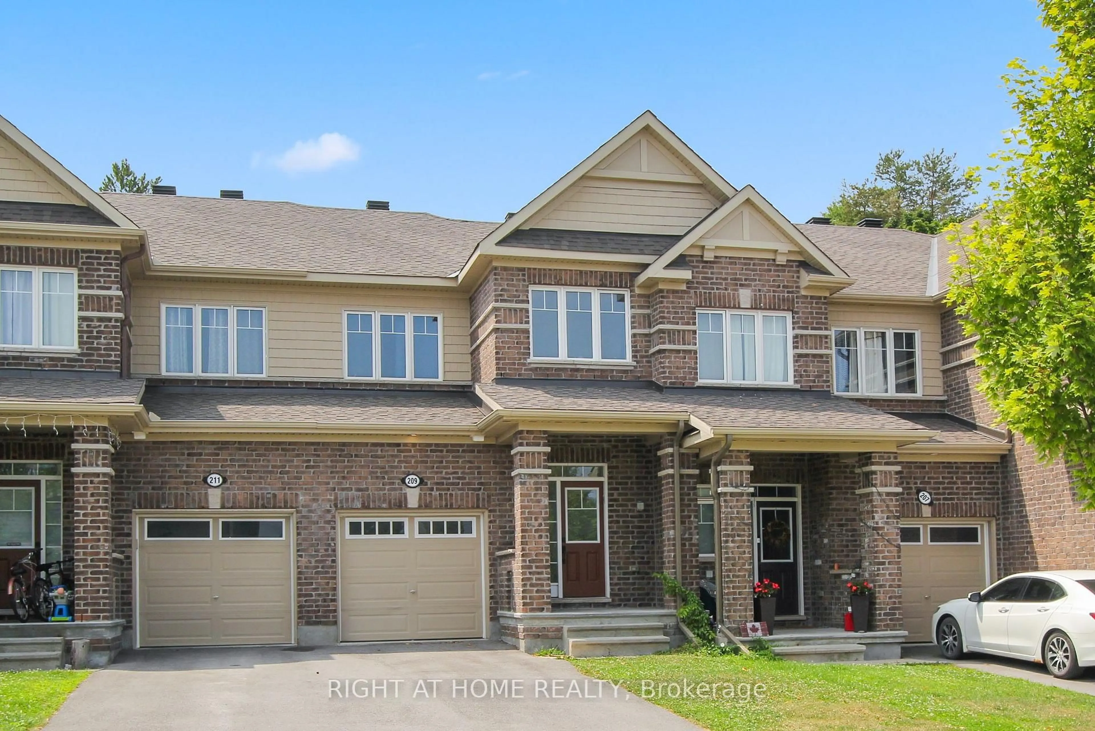 Home with brick exterior material, street for 209 HARTSMERE Dr, Ottawa Ontario K2S 0X8