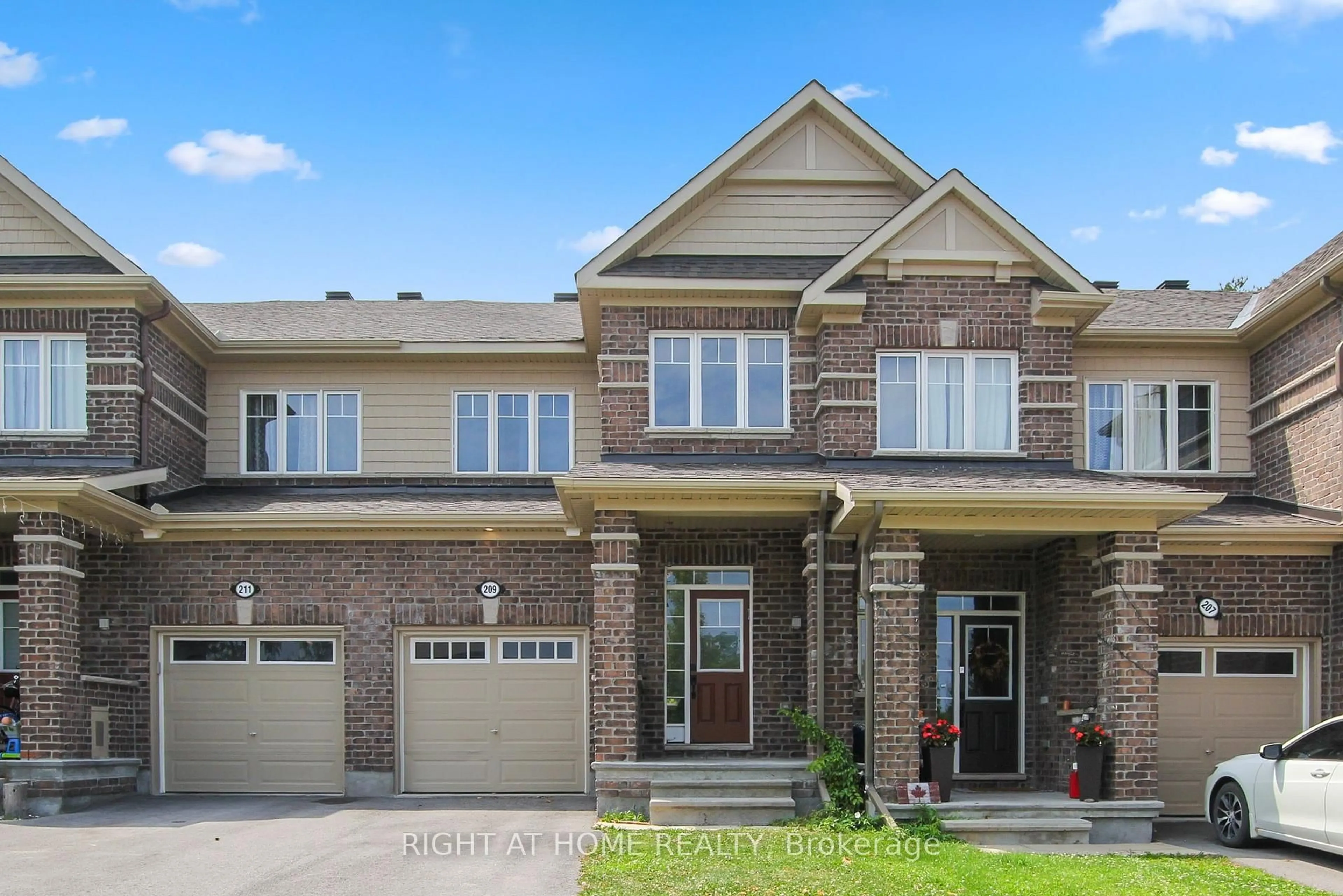 Home with brick exterior material, street for 209 HARTSMERE Dr, Ottawa Ontario K2S 0X8