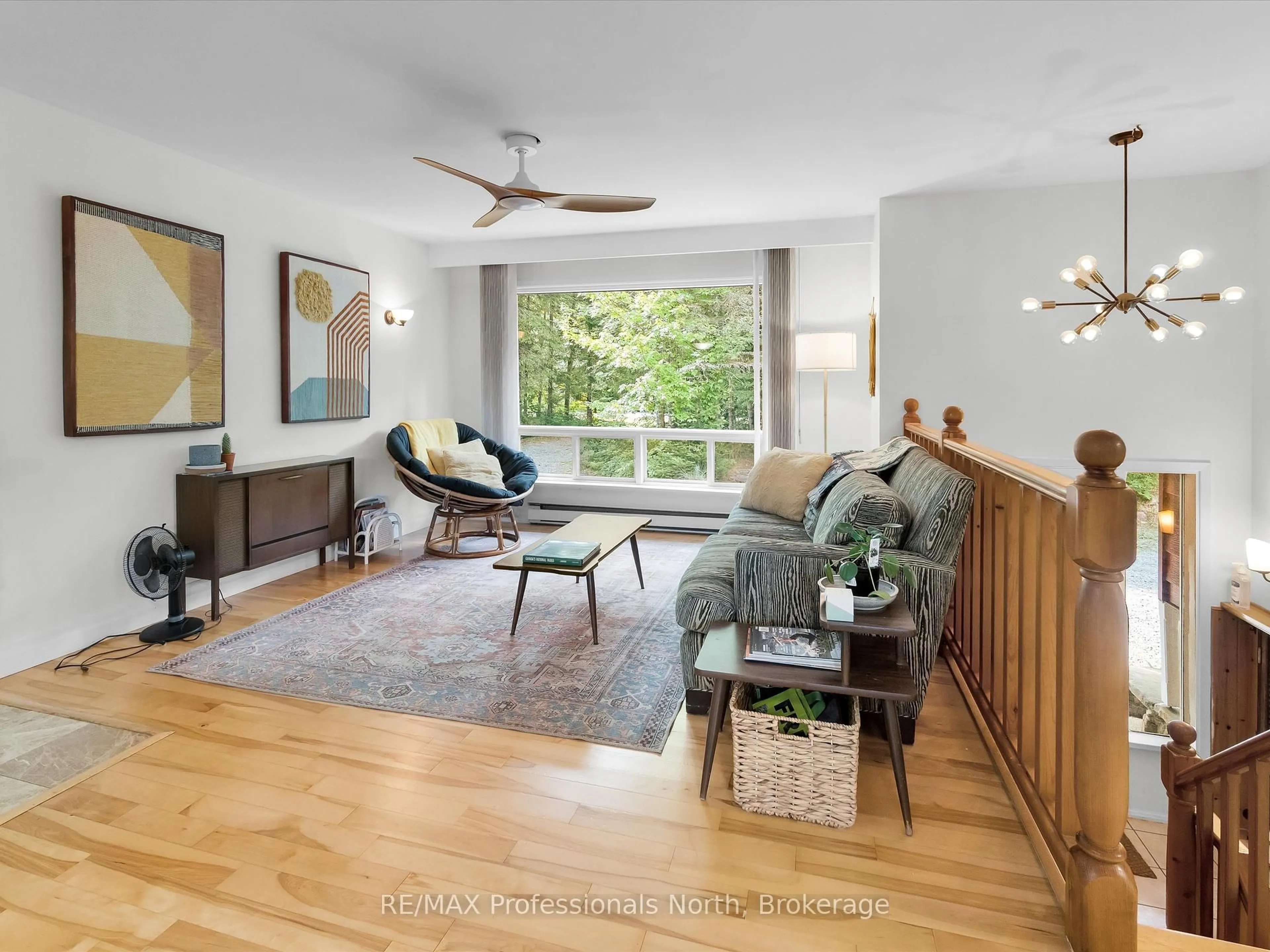 Living room with furniture, wood/laminate floor for 1375 Sherwood Forest Dr, Bracebridge Ontario P1L 1X3