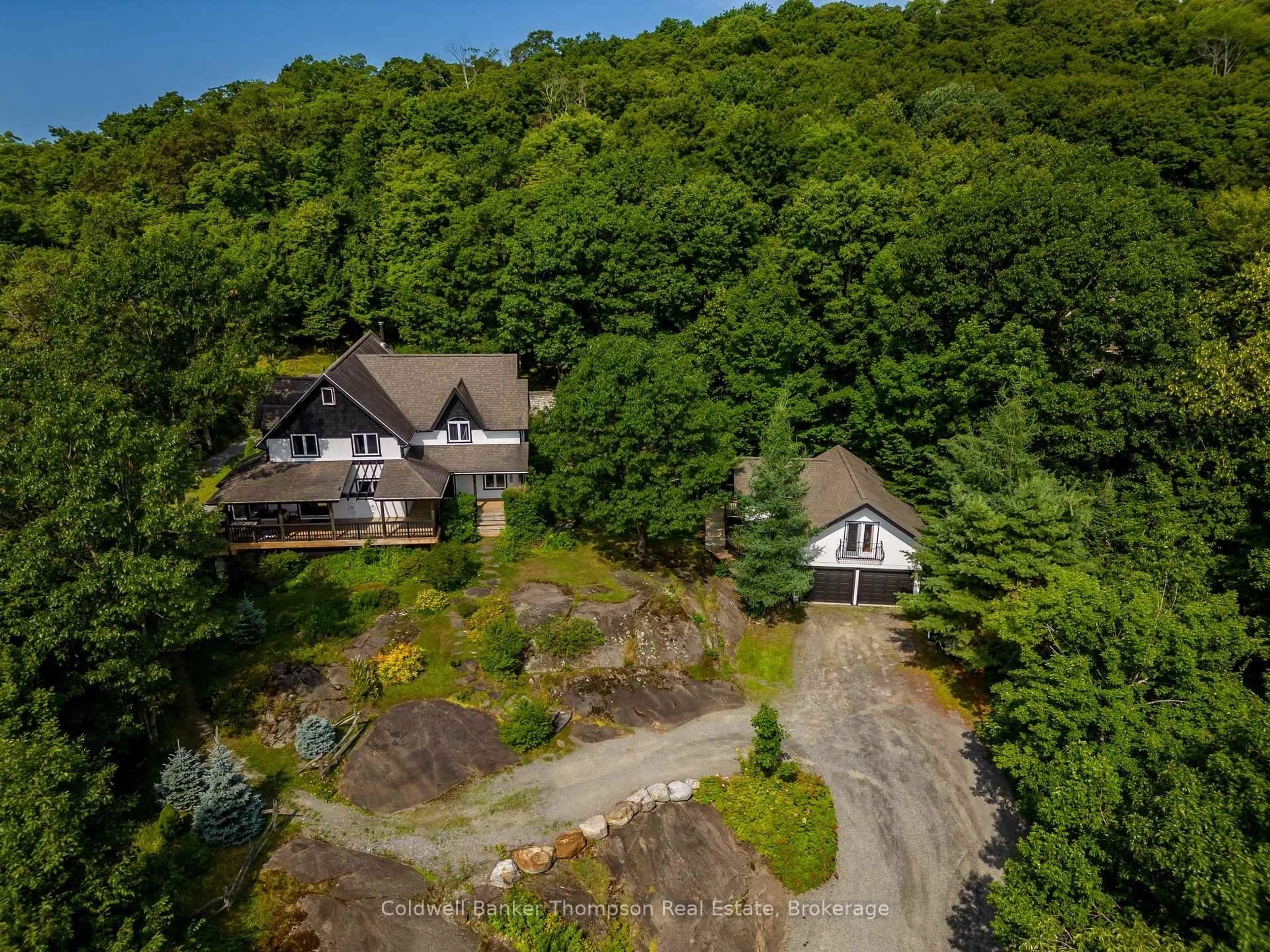 A pic from outside/outdoor area/front of a property/back of a property/a pic from drone, unknown for 54 Logging Tr, Huntsville Ontario P0B 1M0