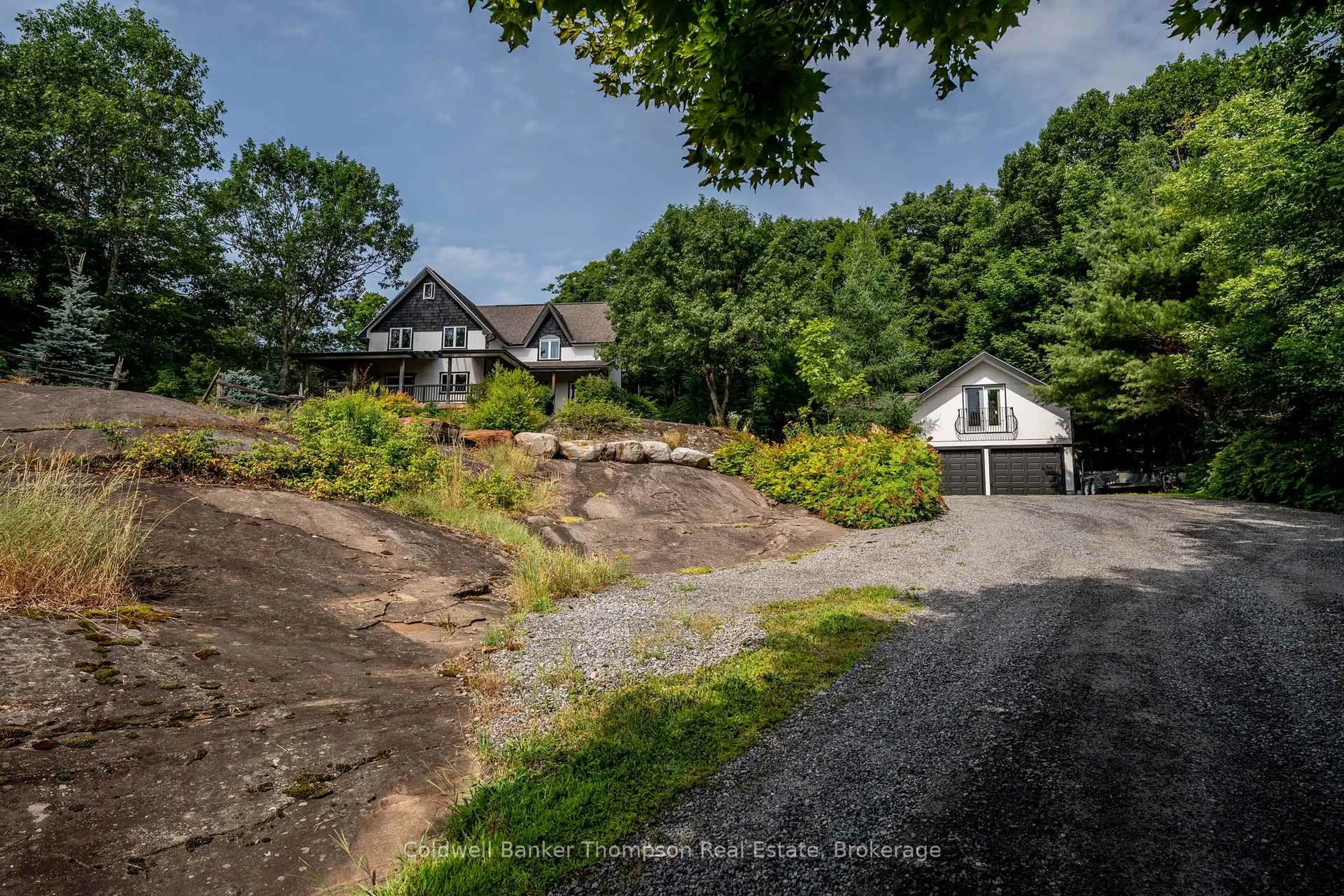 A pic from outside/outdoor area/front of a property/back of a property/a pic from drone, street for 54 Logging Tr, Huntsville Ontario P0B 1M0
