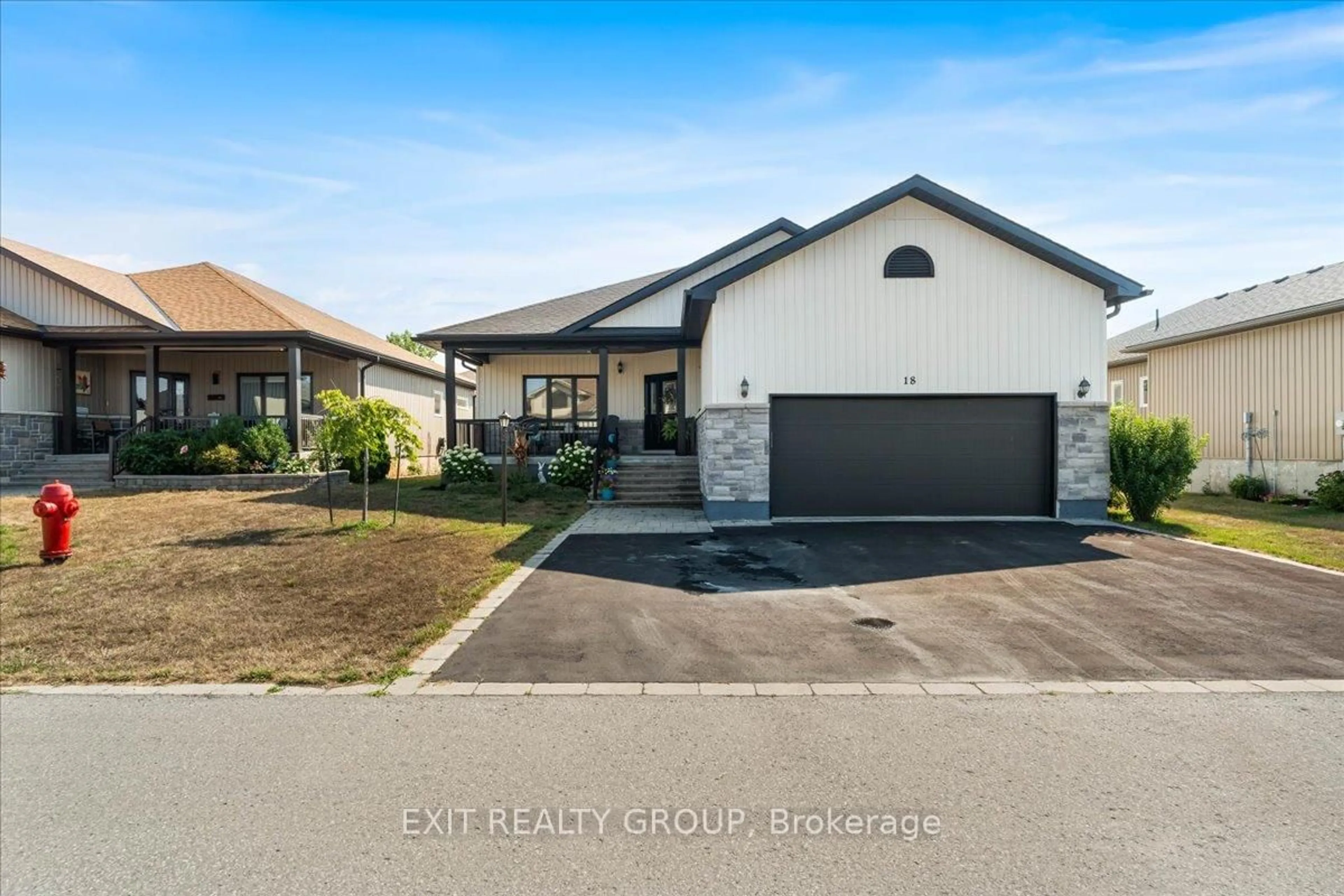 Home with vinyl exterior material, street for 18 Gilbert Cres, Prince Edward County Ontario K0K 3L0