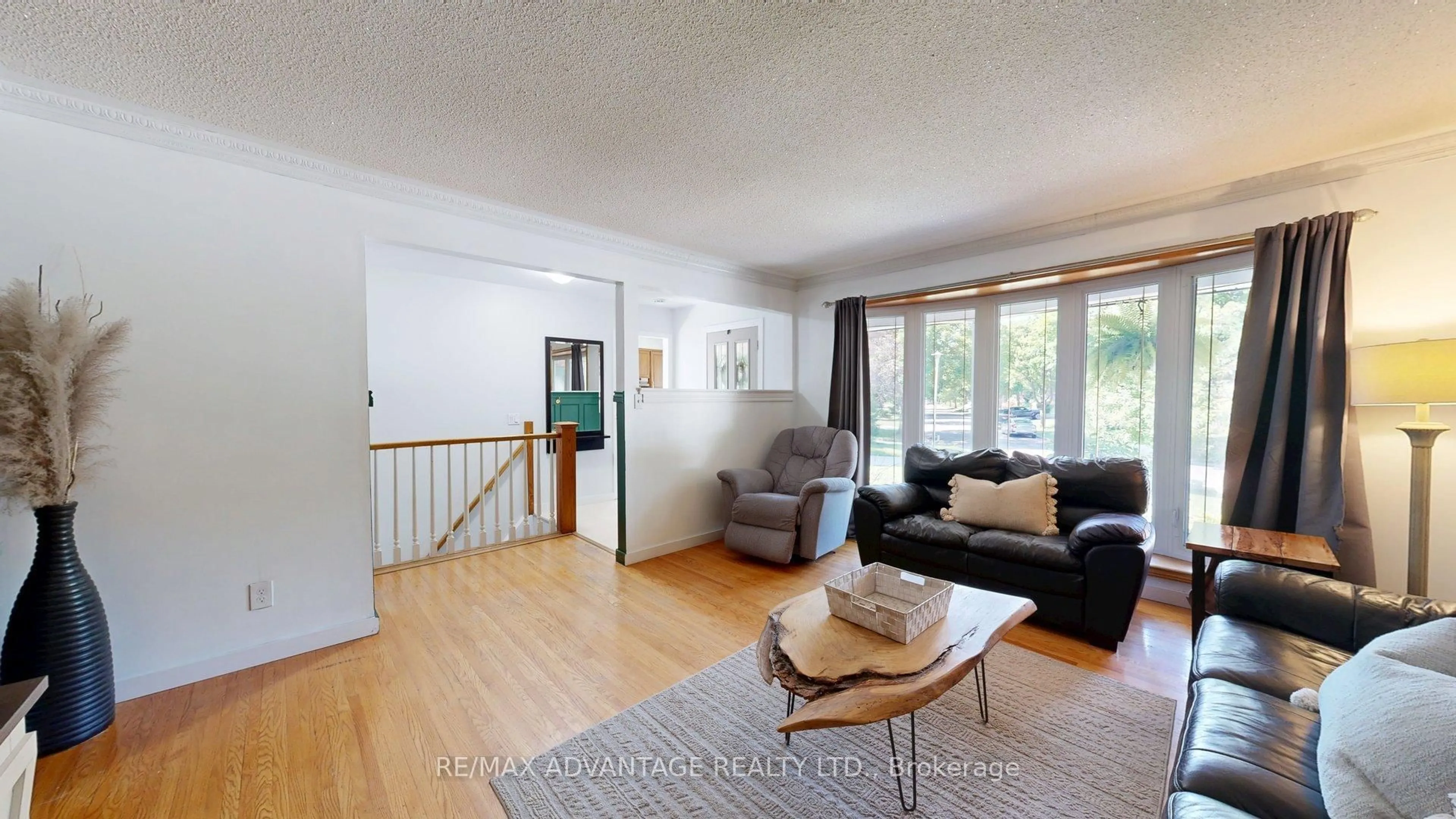 Living room with furniture, wood/laminate floor for 144 Antrim Cres, London South Ontario N6E 1G8