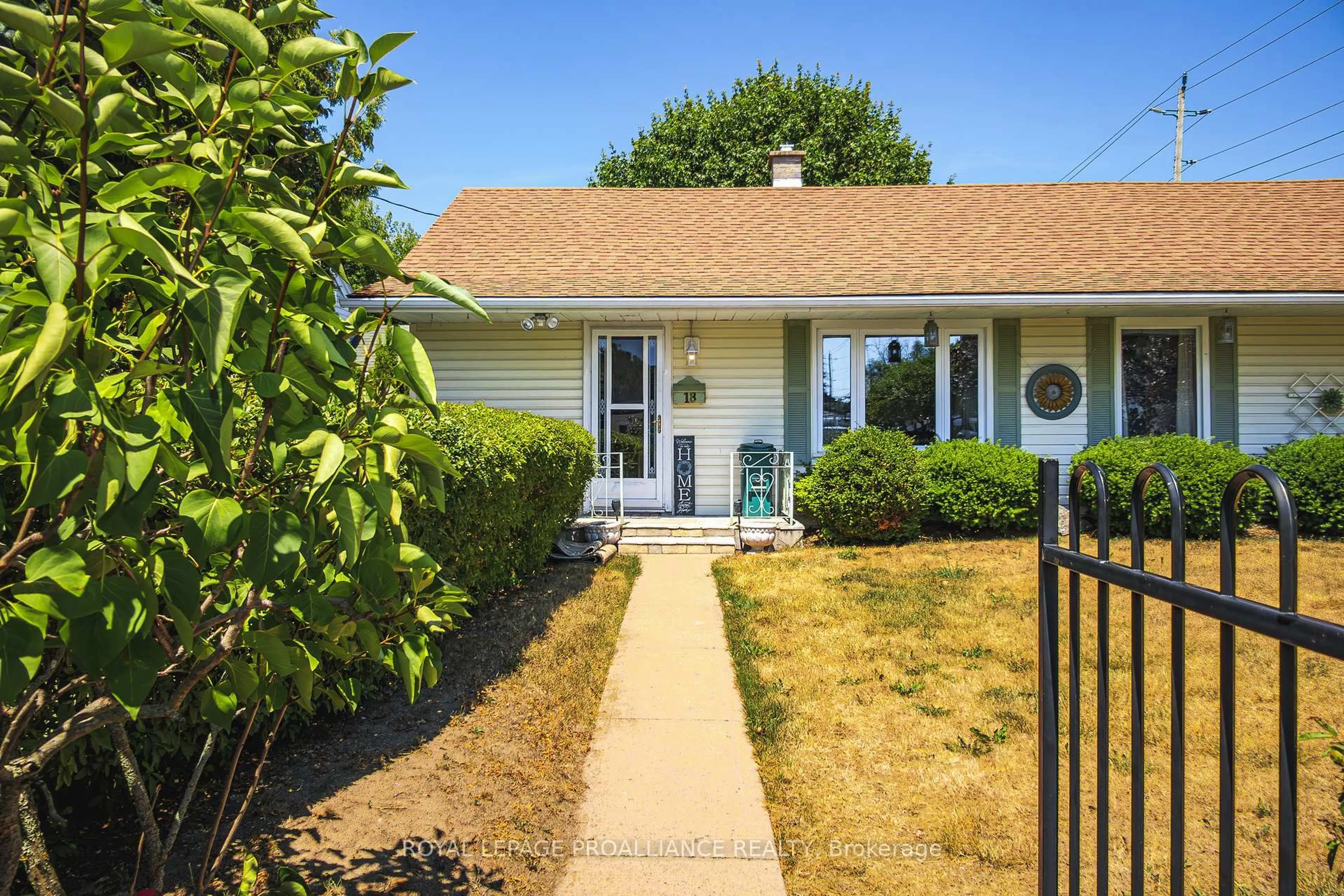 Home with vinyl exterior material, street for 18 Jackson St, Quinte West Ontario K8V 1Z7