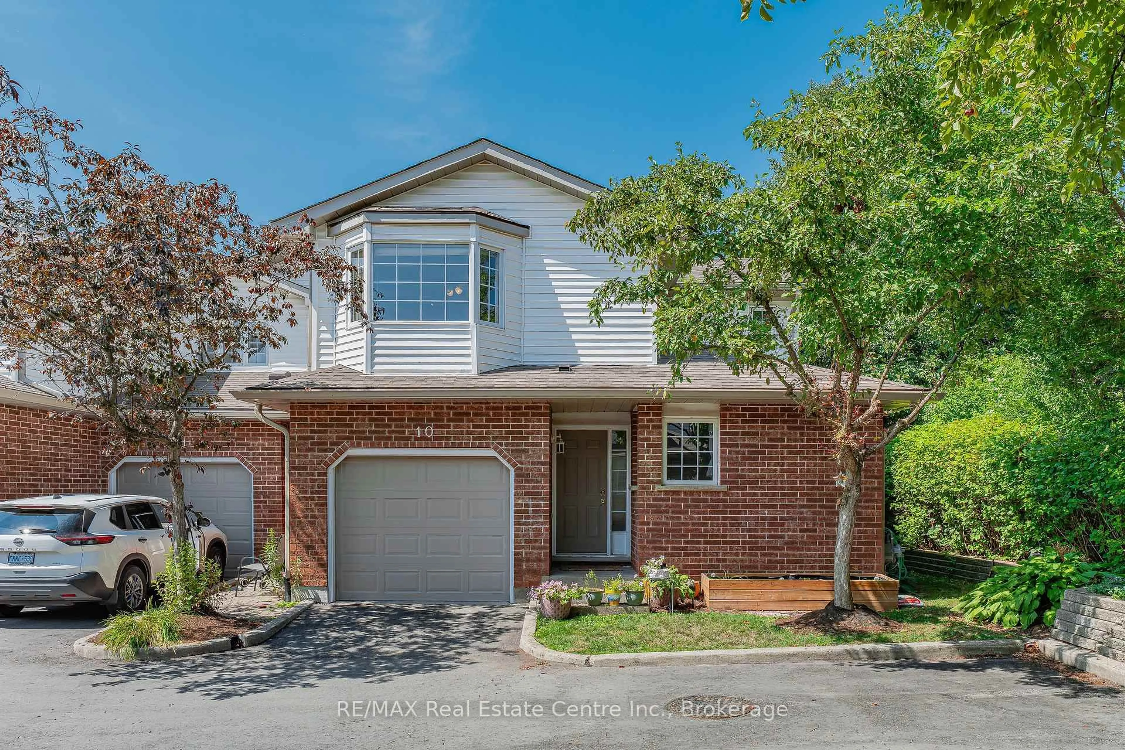 Home with brick exterior material, street for 229 Baker St #10, Waterloo Ontario N2T 2R4