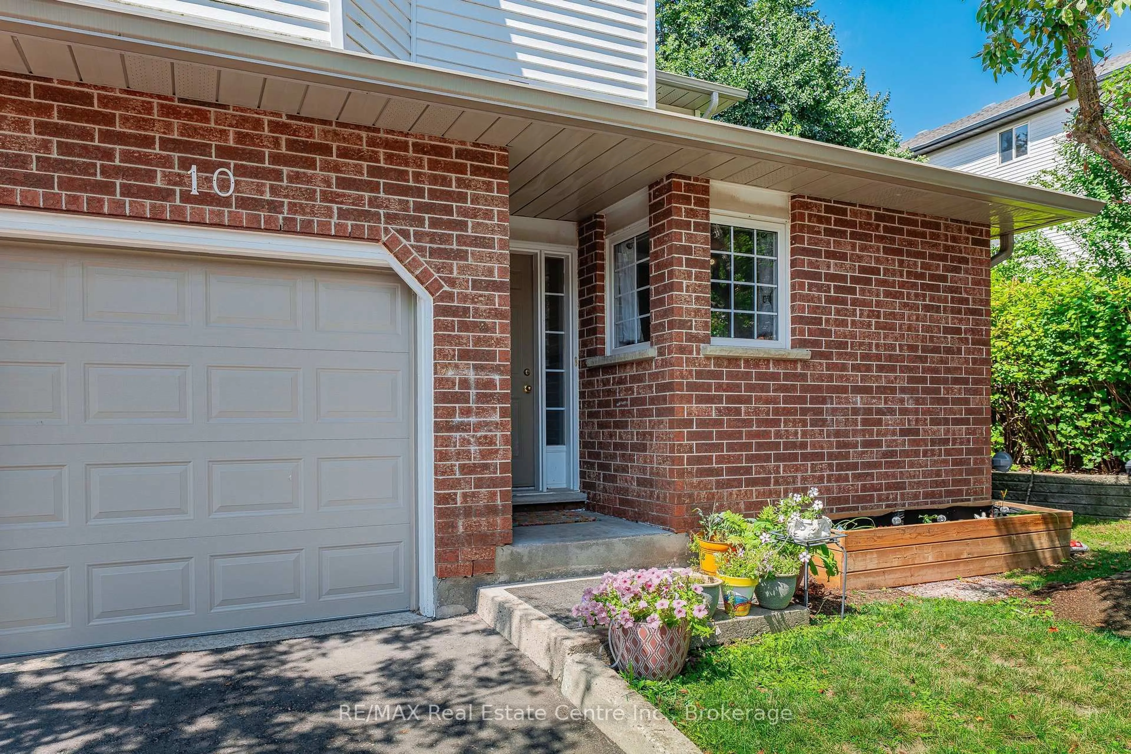 Home with brick exterior material, street for 229 Baker St #10, Waterloo Ontario N2T 2R4