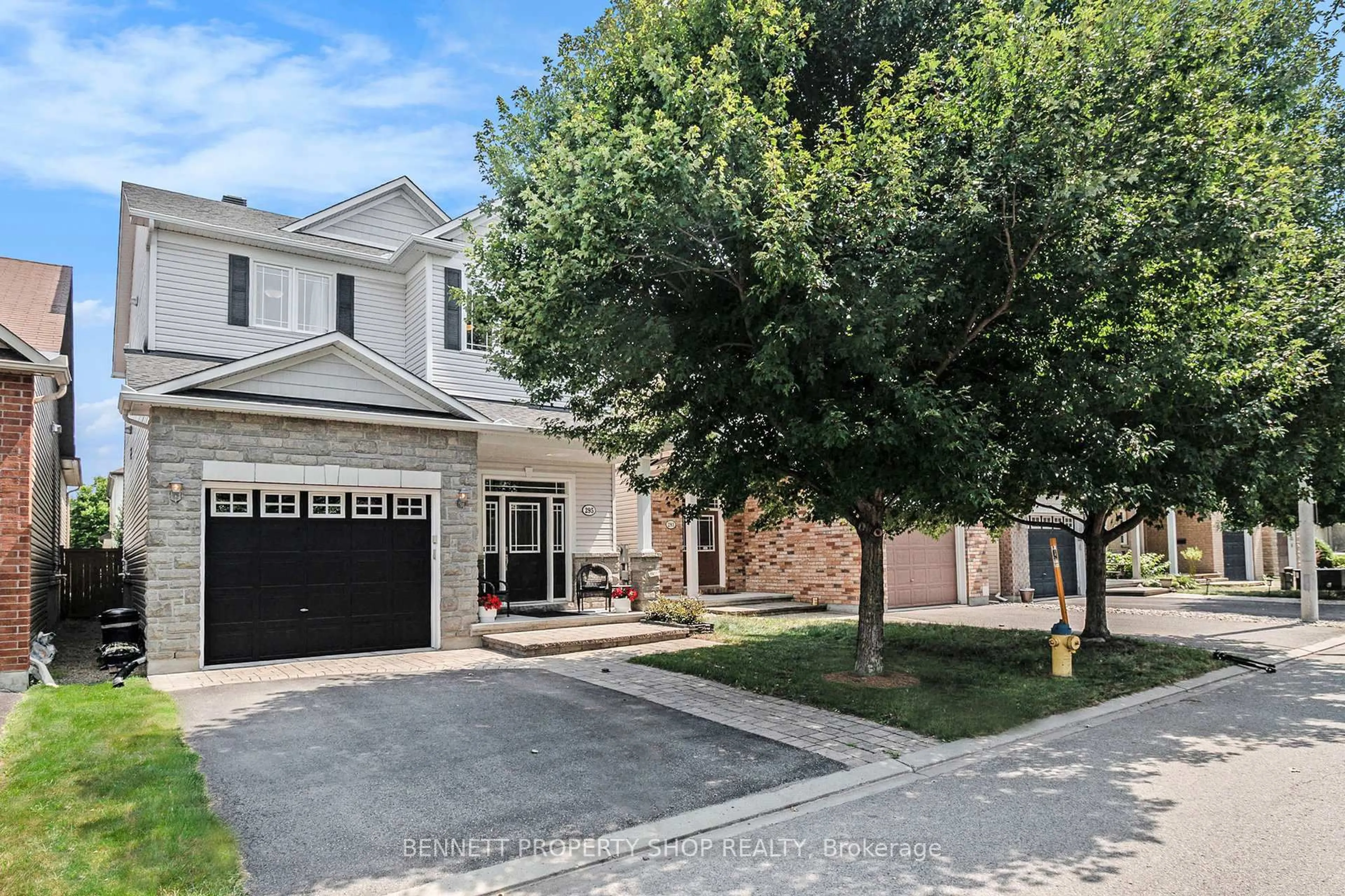 Home with brick exterior material, street for 295 Harthill Way, Ottawa Ontario K2J 0P3