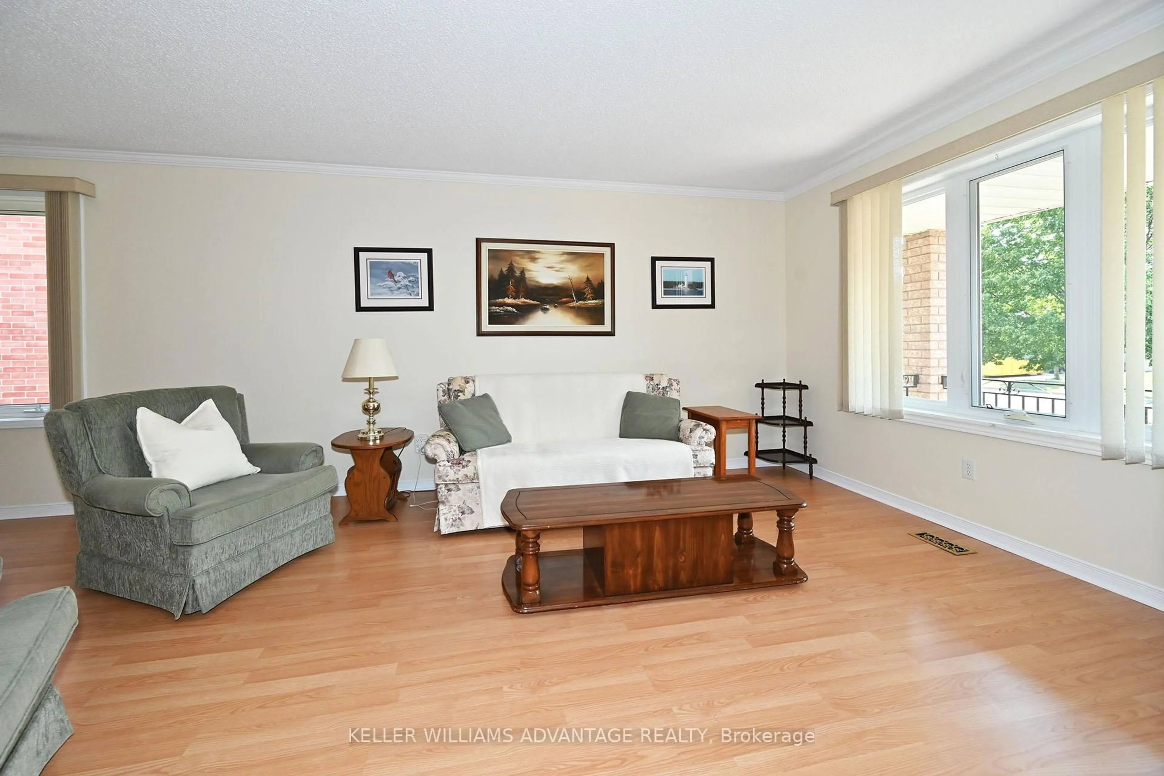 Living room with furniture, wood/laminate floor for 90 East House Cres, Cobourg Ontario K9A 5K3