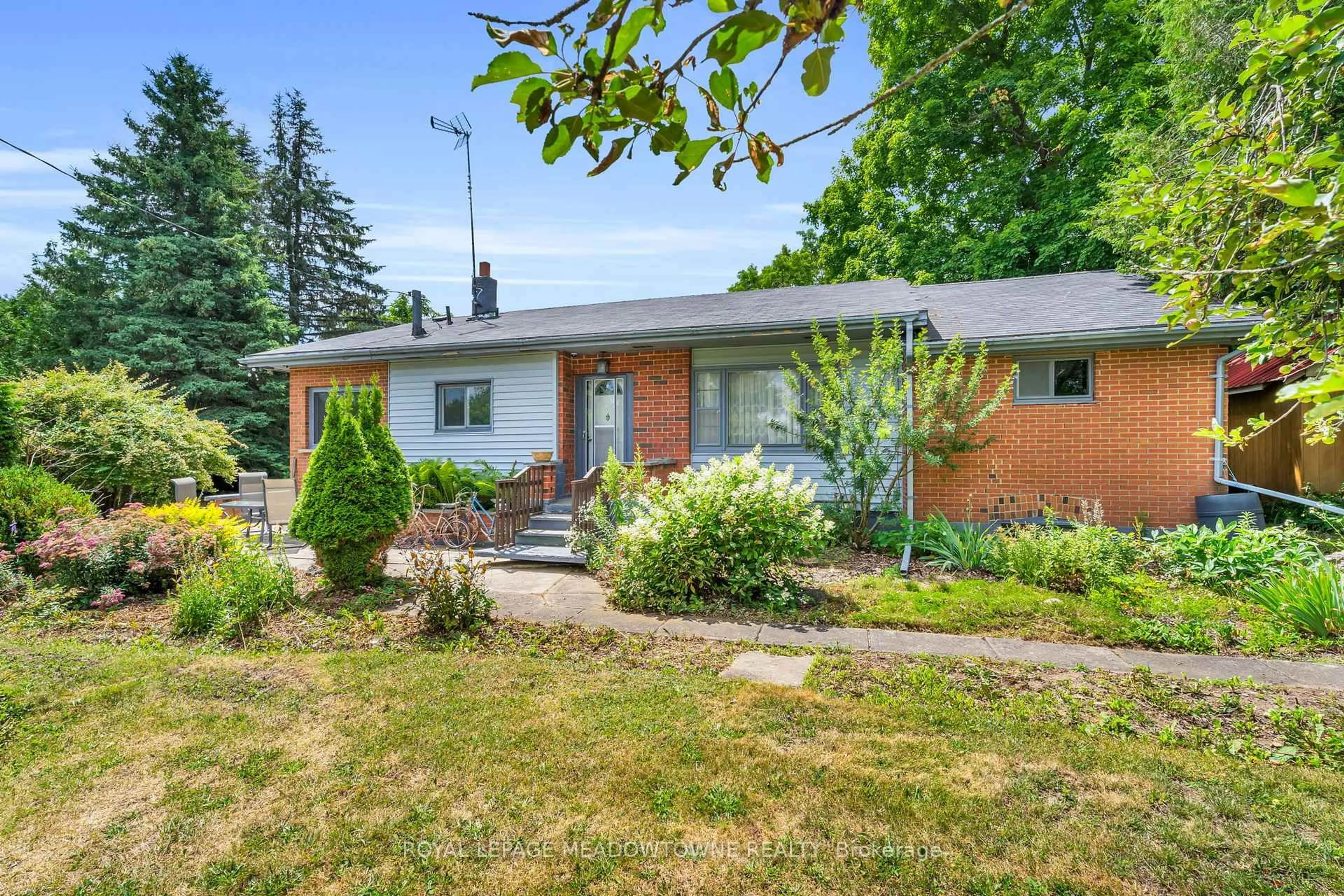 Home with brick exterior material, street for 9483 Wellington Rd 124, Erin Ontario N0B 1T0