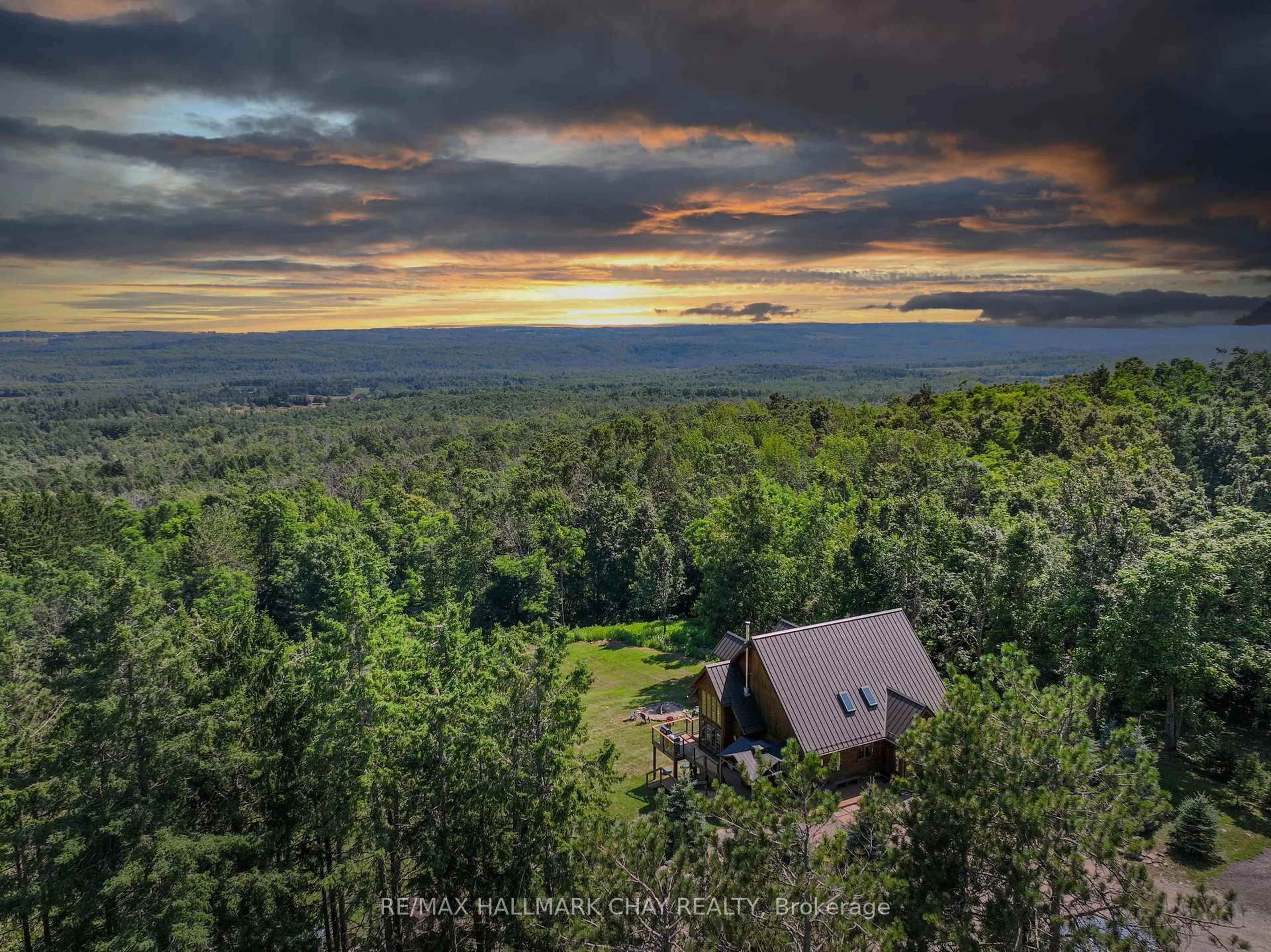 A pic from outside/outdoor area/front of a property/back of a property/a pic from drone, forest/trees view for 707412 County Rd 21 Rd, Mulmur Ontario K8V 5P8
