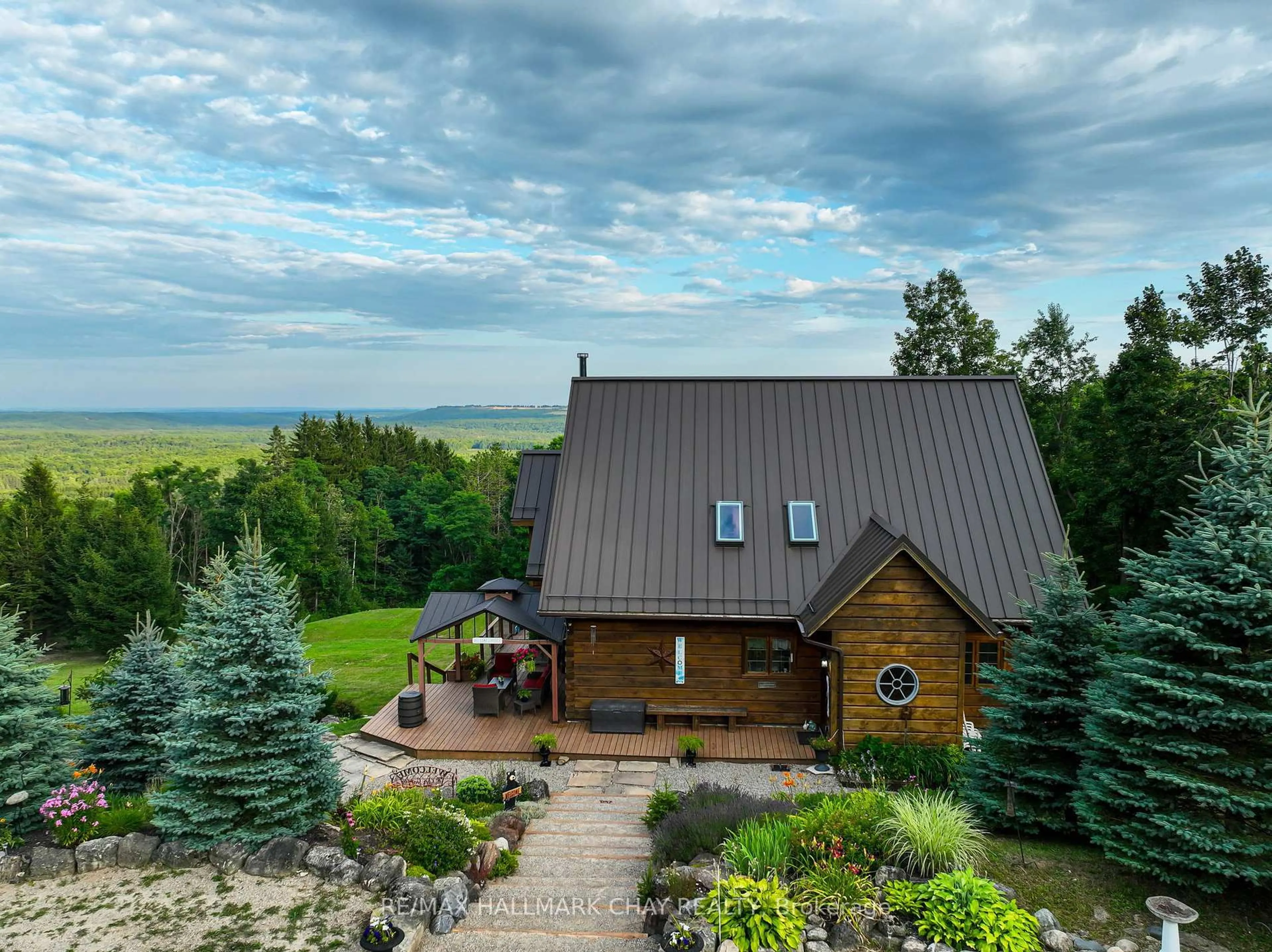 A pic from outside/outdoor area/front of a property/back of a property/a pic from drone, water/lake/river/ocean view for 707412 County Rd 21 Rd, Mulmur Ontario K8V 5P8