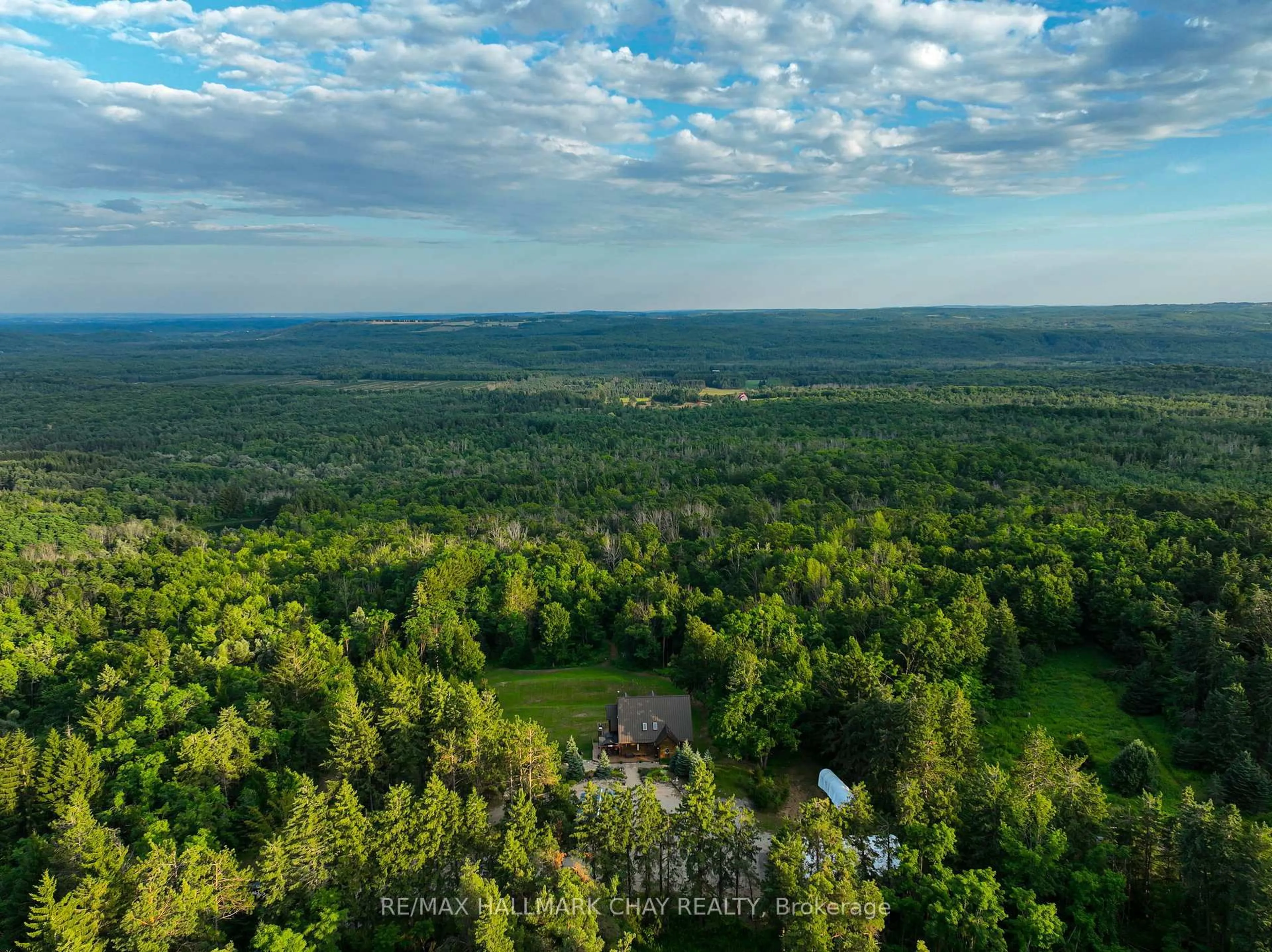 A pic from outside/outdoor area/front of a property/back of a property/a pic from drone, forest/trees view for 707412 County Rd 21 Rd, Mulmur Ontario K8V 5P8