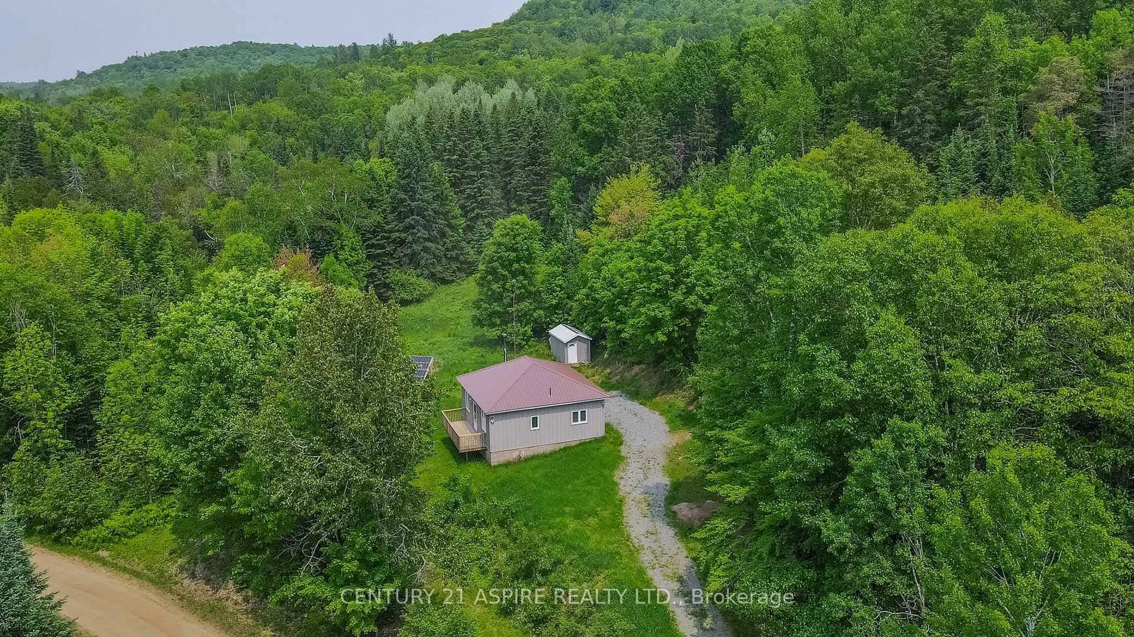 A pic from outside/outdoor area/front of a property/back of a property/a pic from drone, forest/trees view for 117 Craigmont Rd, Combermere Ontario K0J 1L0