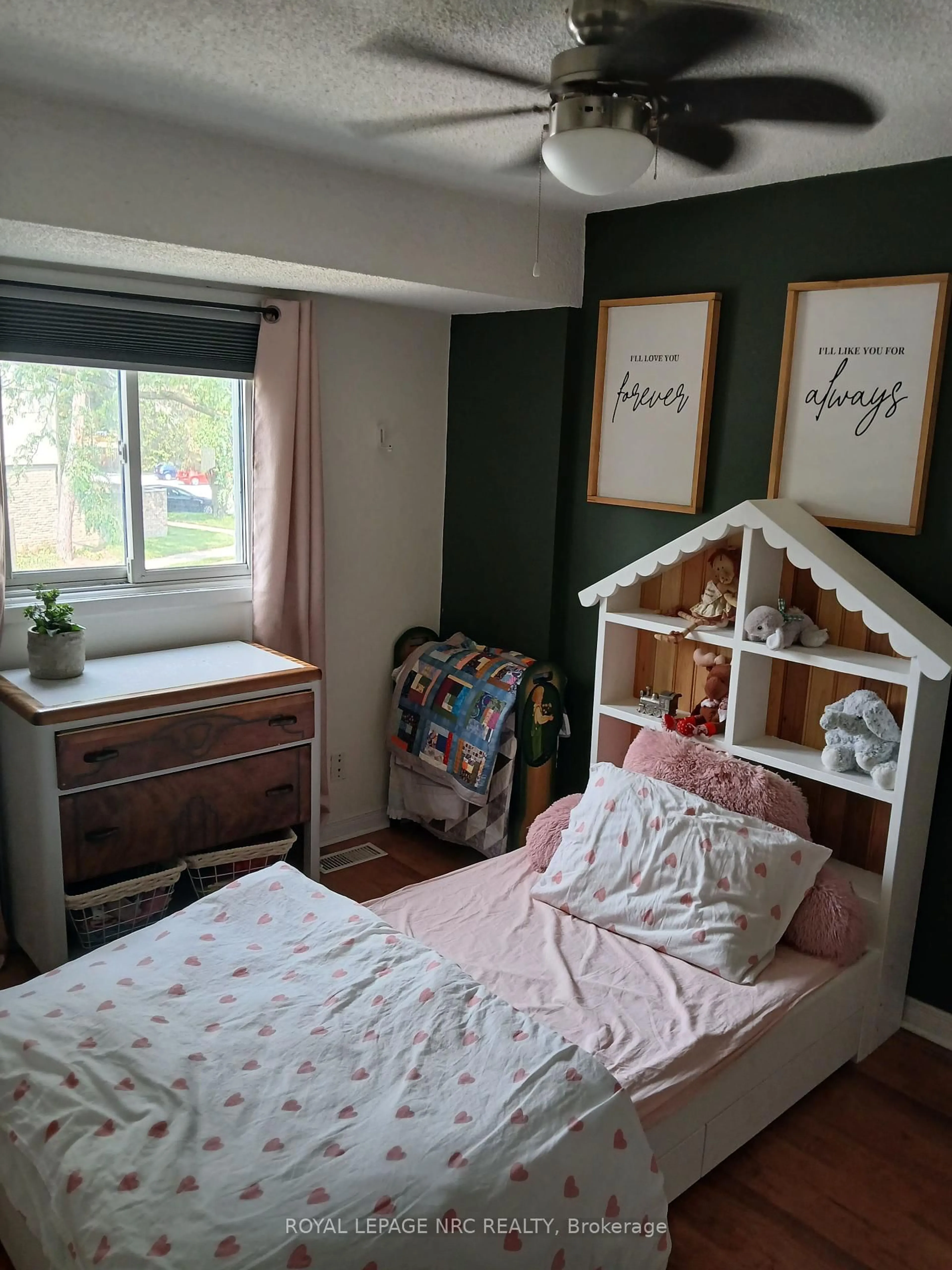Bedroom with bed, wood/laminate floor for 302 Vine St #31, St. Catharines Ontario L2M 7M6