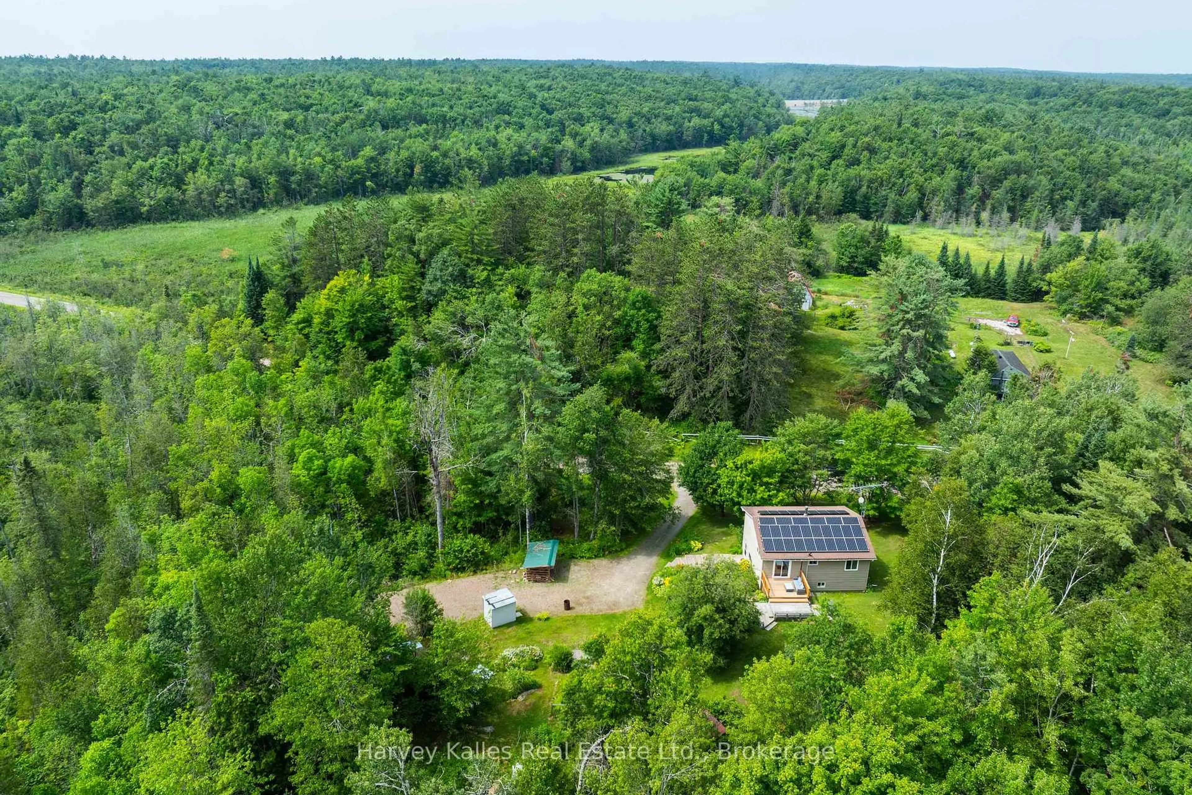 A pic from outside/outdoor area/front of a property/back of a property/a pic from drone, forest/trees view for 1094 Prospect Lake Rd, Bracebridge Ontario P1L 1X1