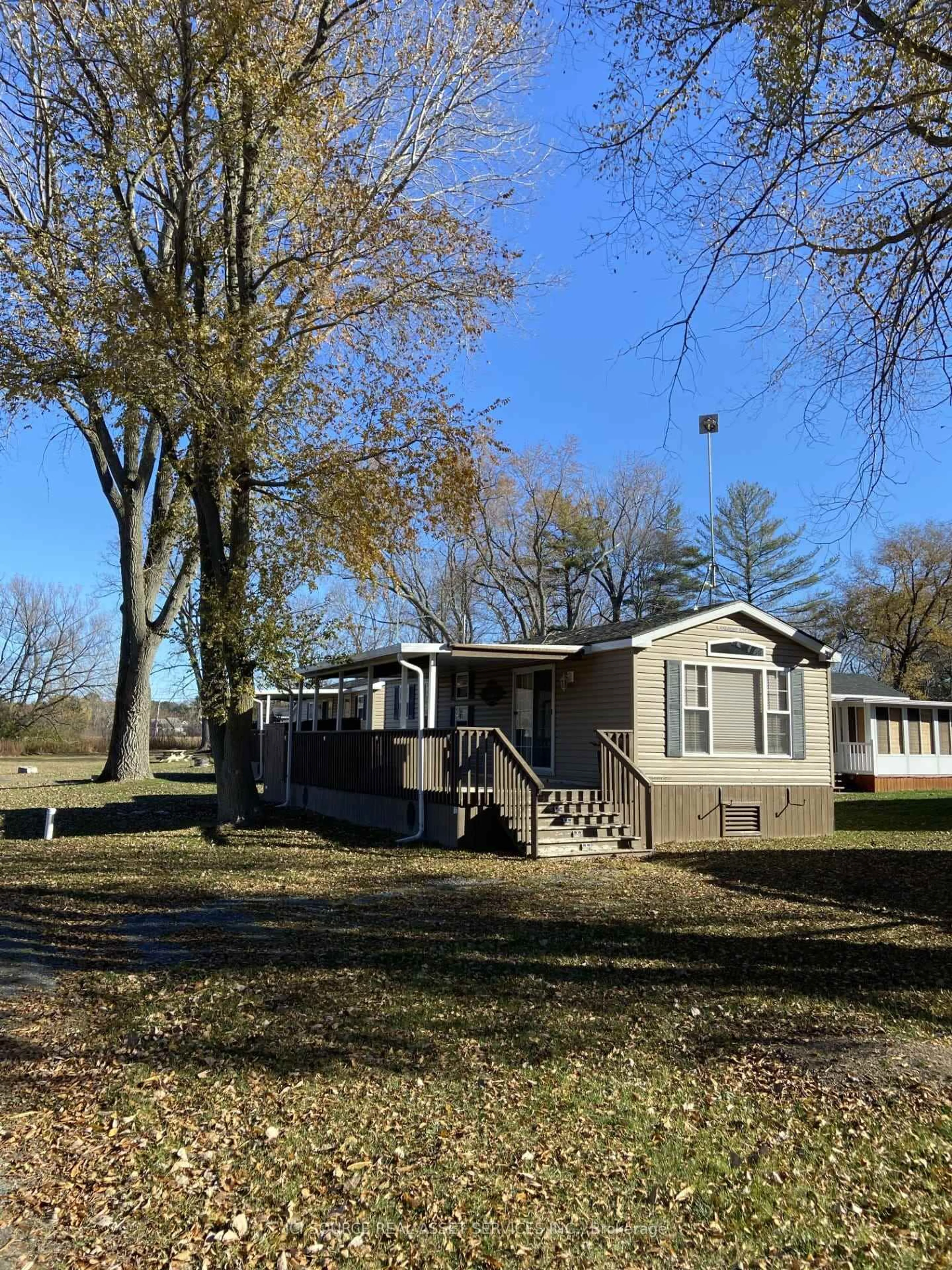 A pic from outside/outdoor area/front of a property/back of a property/a pic from drone, water/lake/river/ocean view for 486 County Road 18 #TPL08, Prince Edward County Ontario K0K 1P0