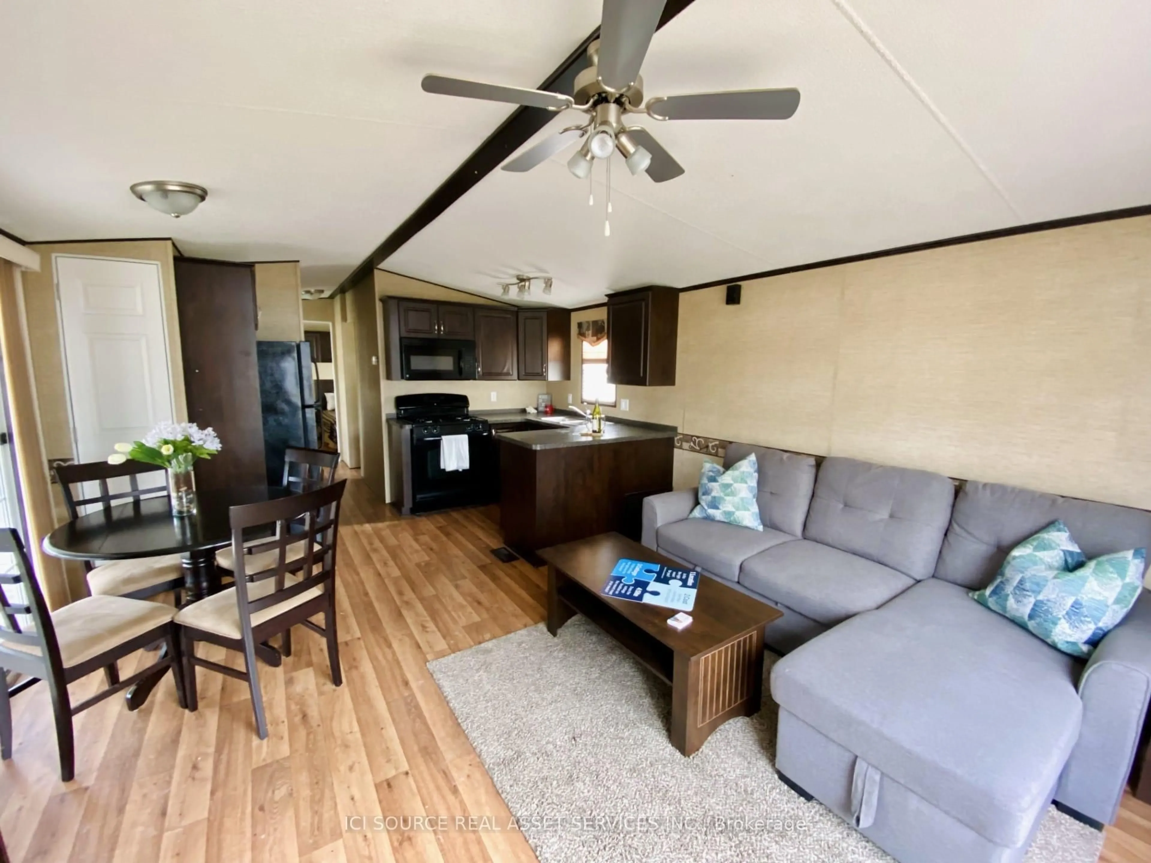Living room with furniture, wood/laminate floor for 486 County Road 18 #TPL08, Prince Edward County Ontario K0K 1P0