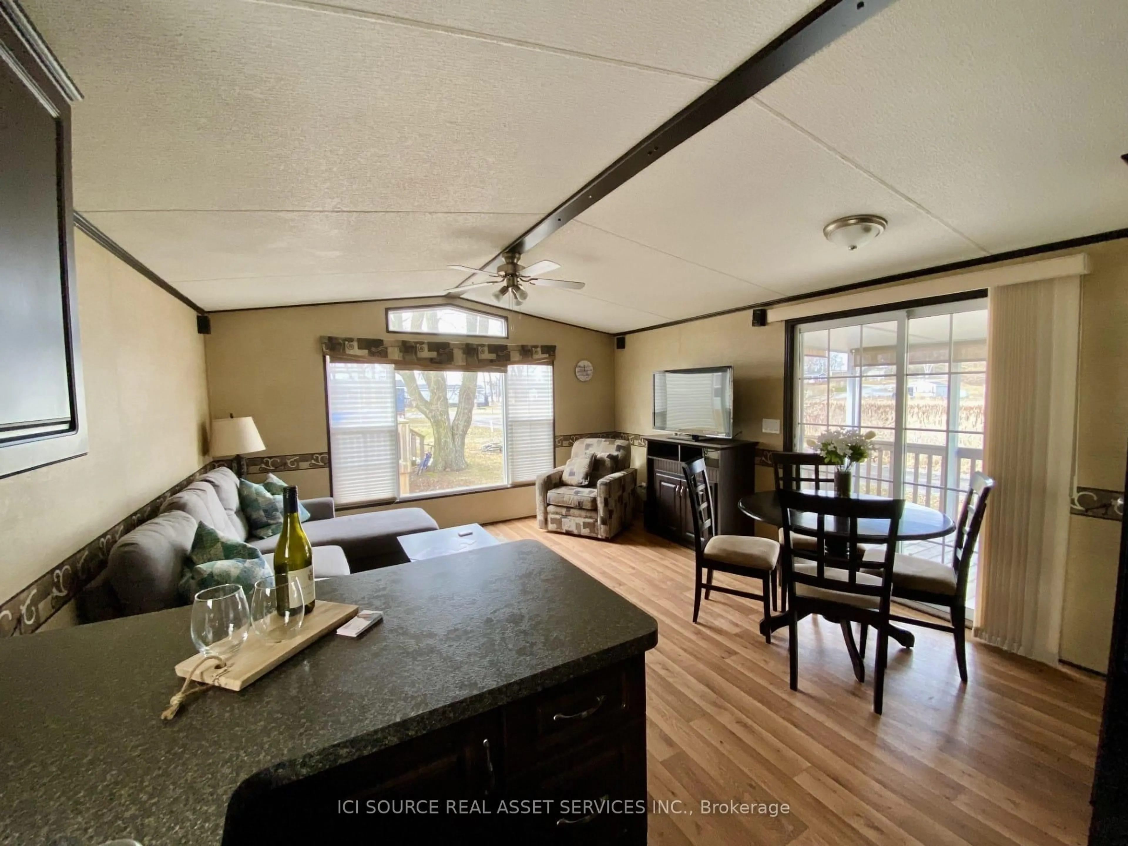 Living room with furniture, wood/laminate floor for 486 County Road 18 #TPL08, Prince Edward County Ontario K0K 1P0