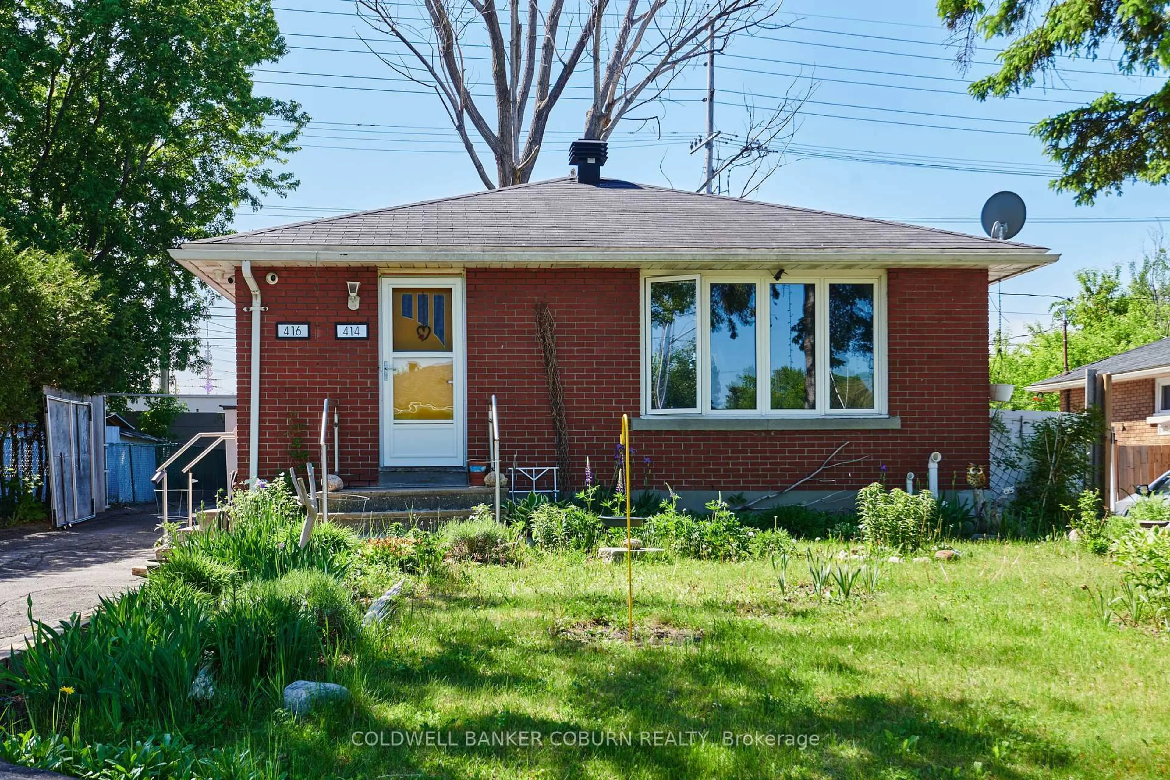 Home with brick exterior material, street for 414 Presland Rd, Ottawa Ontario K1K 2B5