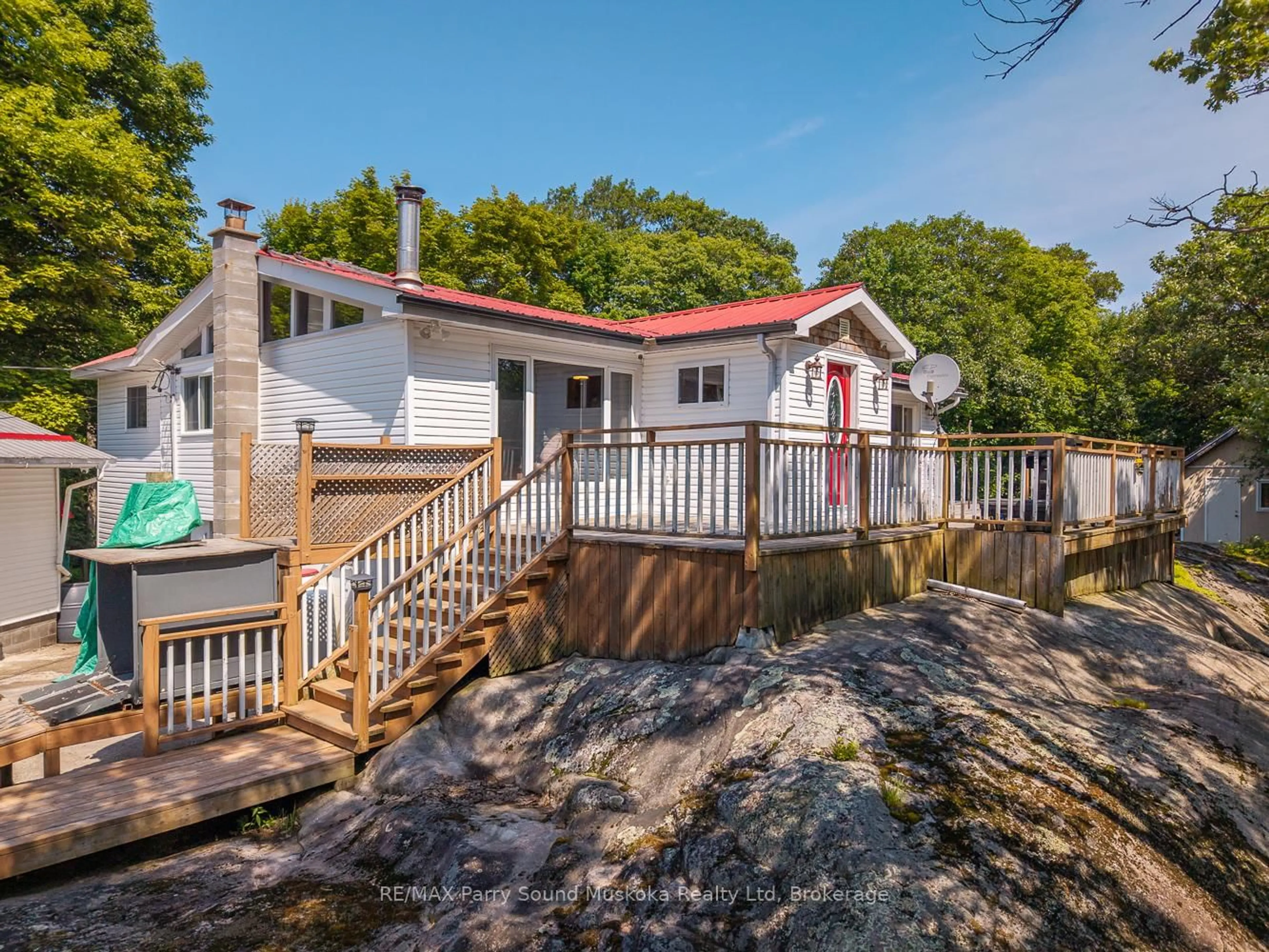 A pic from outside/outdoor area/front of a property/back of a property/a pic from drone, water/lake/river/ocean view for 124 Pinewood Rd, McDougall Ontario P2A 2W9