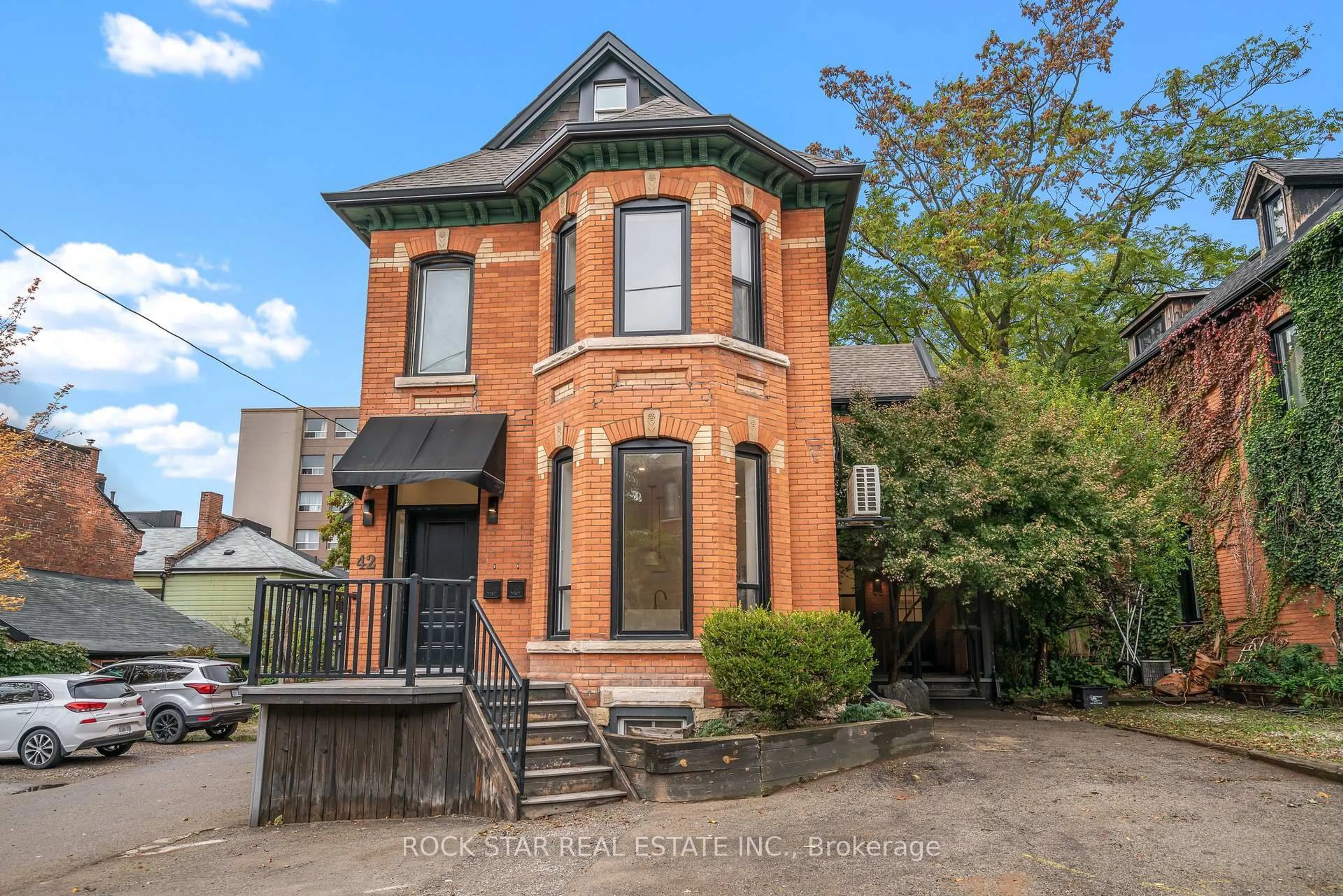 Home with brick exterior material, street for 42 Ray St, Hamilton Ontario L8P 3V3