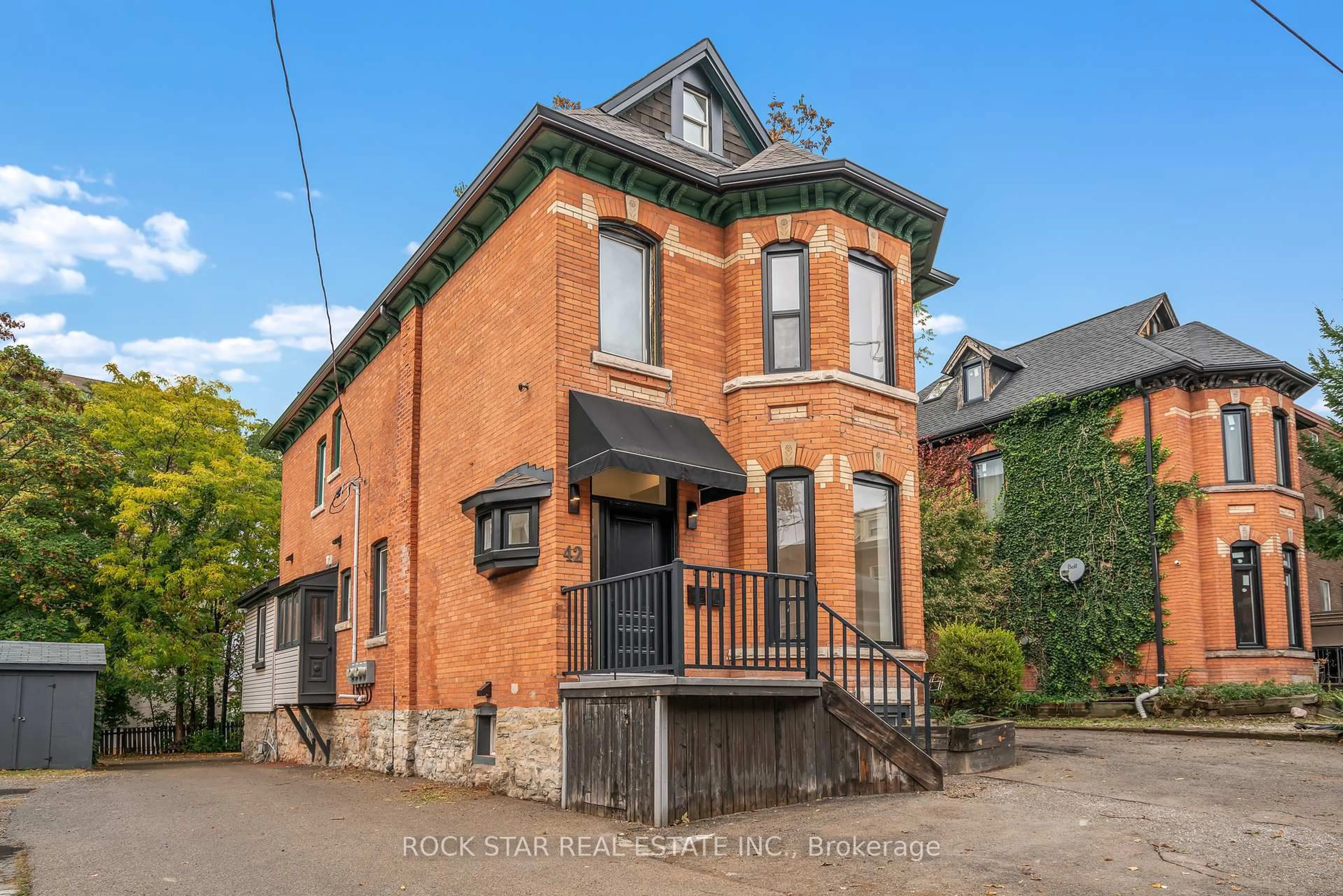 Home with brick exterior material, building for 42 Ray St, Hamilton Ontario L8P 3V3