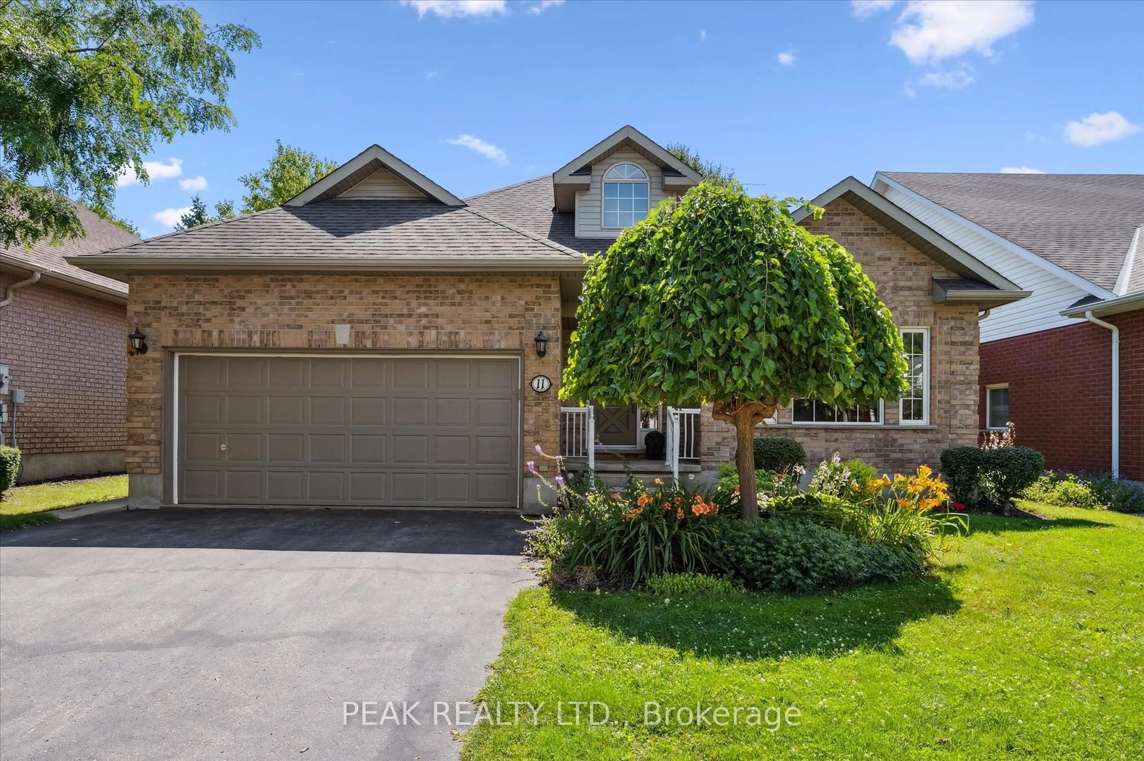 Home with brick exterior material, street for 11 Parkside Dr, Guelph Ontario N1G 4X7