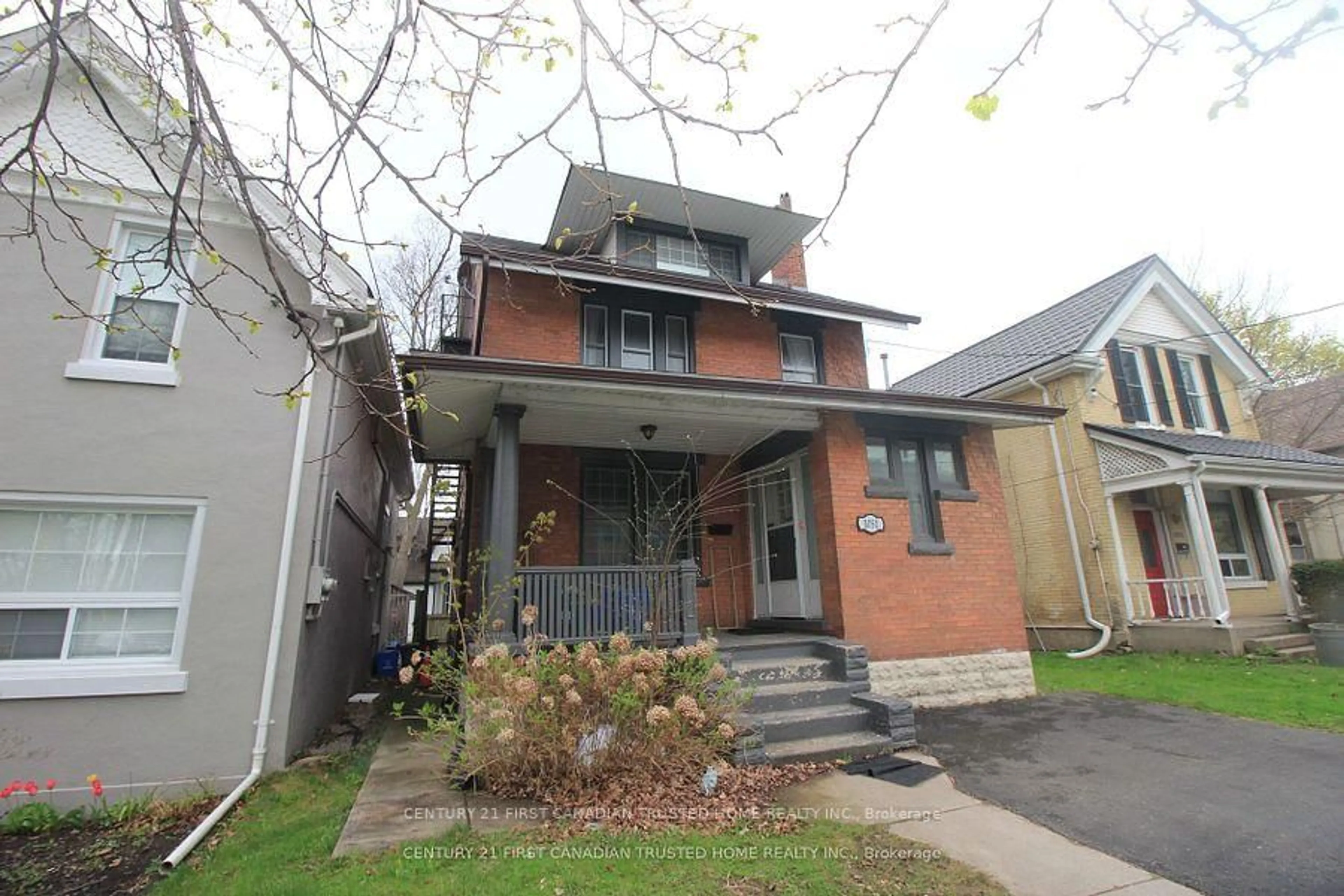 Home with brick exterior material, street for 1051 Richmond St, London East Ontario N6A 3J7