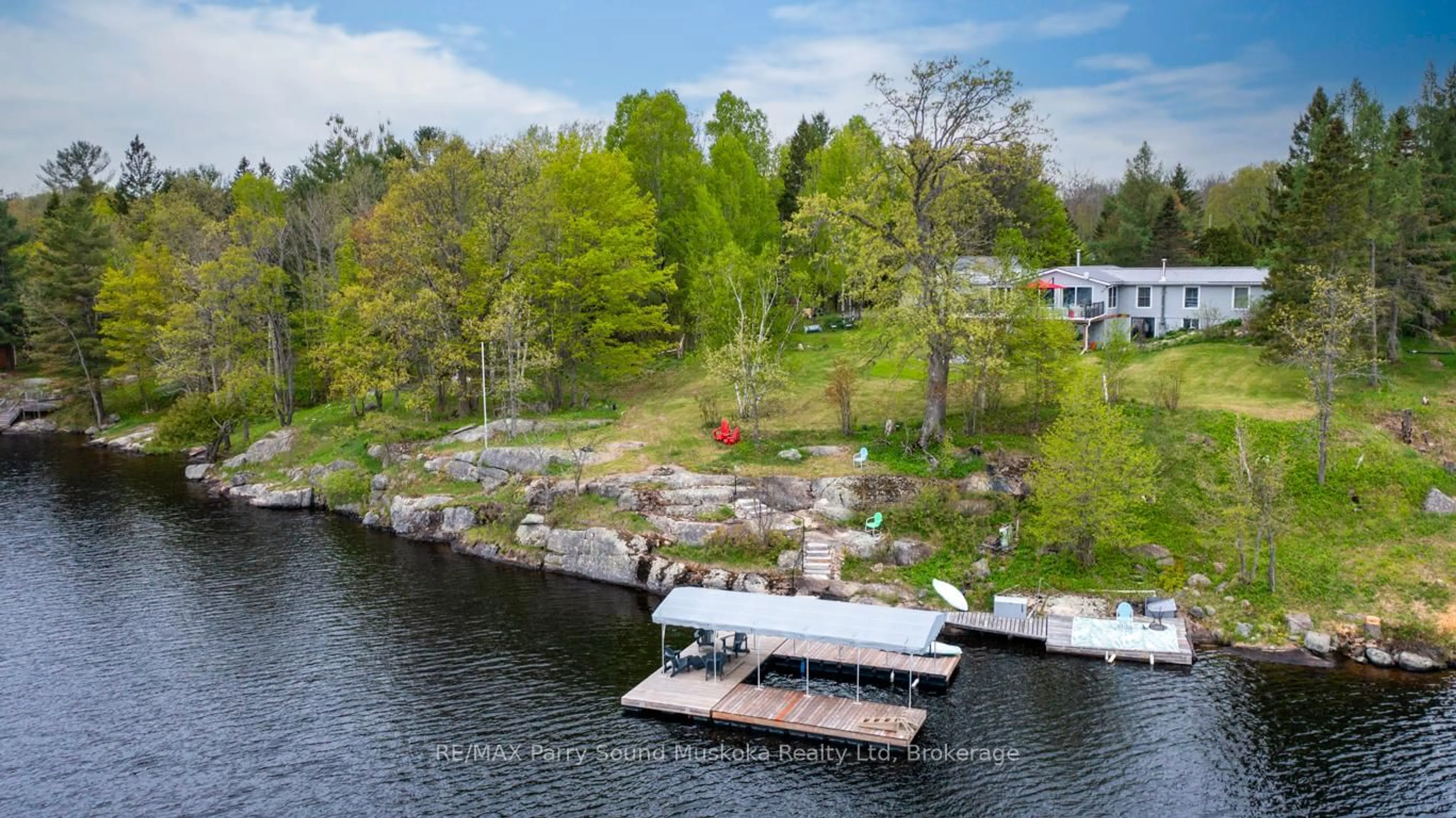 A pic from outside/outdoor area/front of a property/back of a property/a pic from drone, water/lake/river/ocean view for 28 Lakeside Dr, McKellar Ontario P2A 0B4