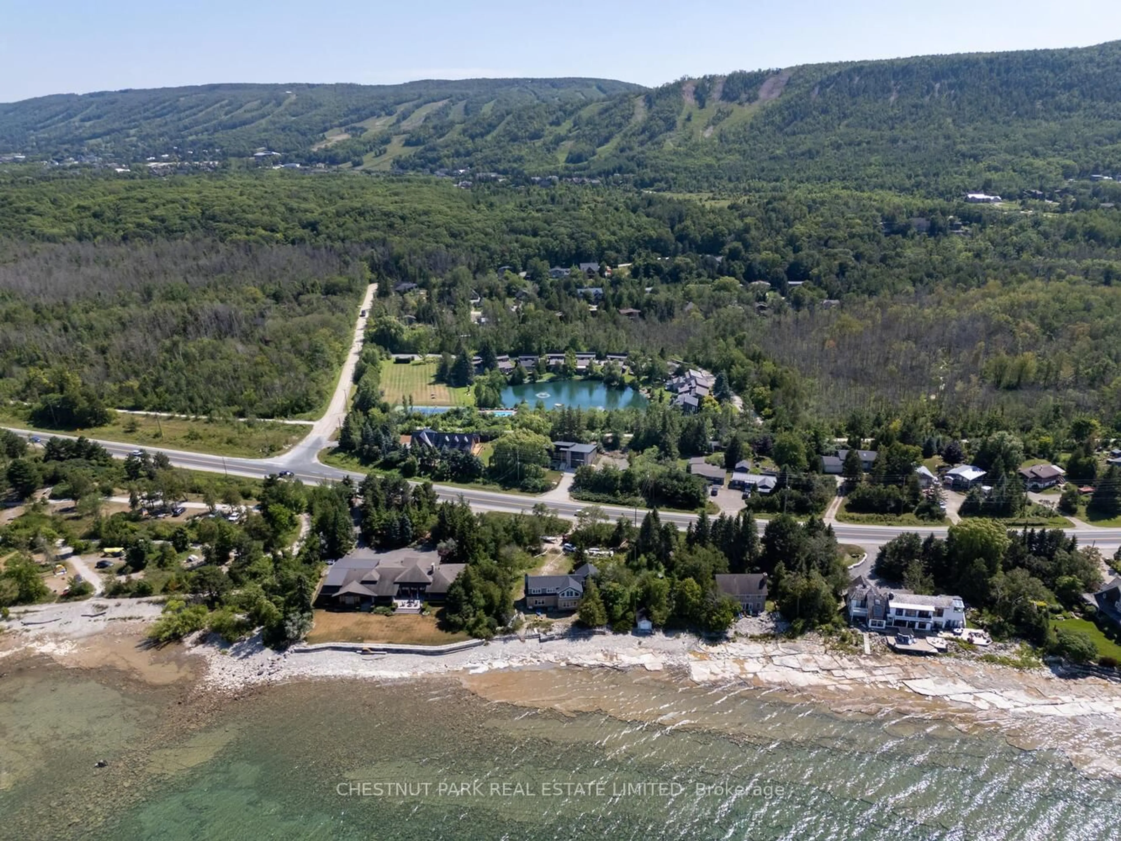 A pic from outside/outdoor area/front of a property/back of a property/a pic from drone, water/lake/river/ocean view for 116 Hidden Lake Rd #9, Blue Mountains Ontario L9Y 0T6