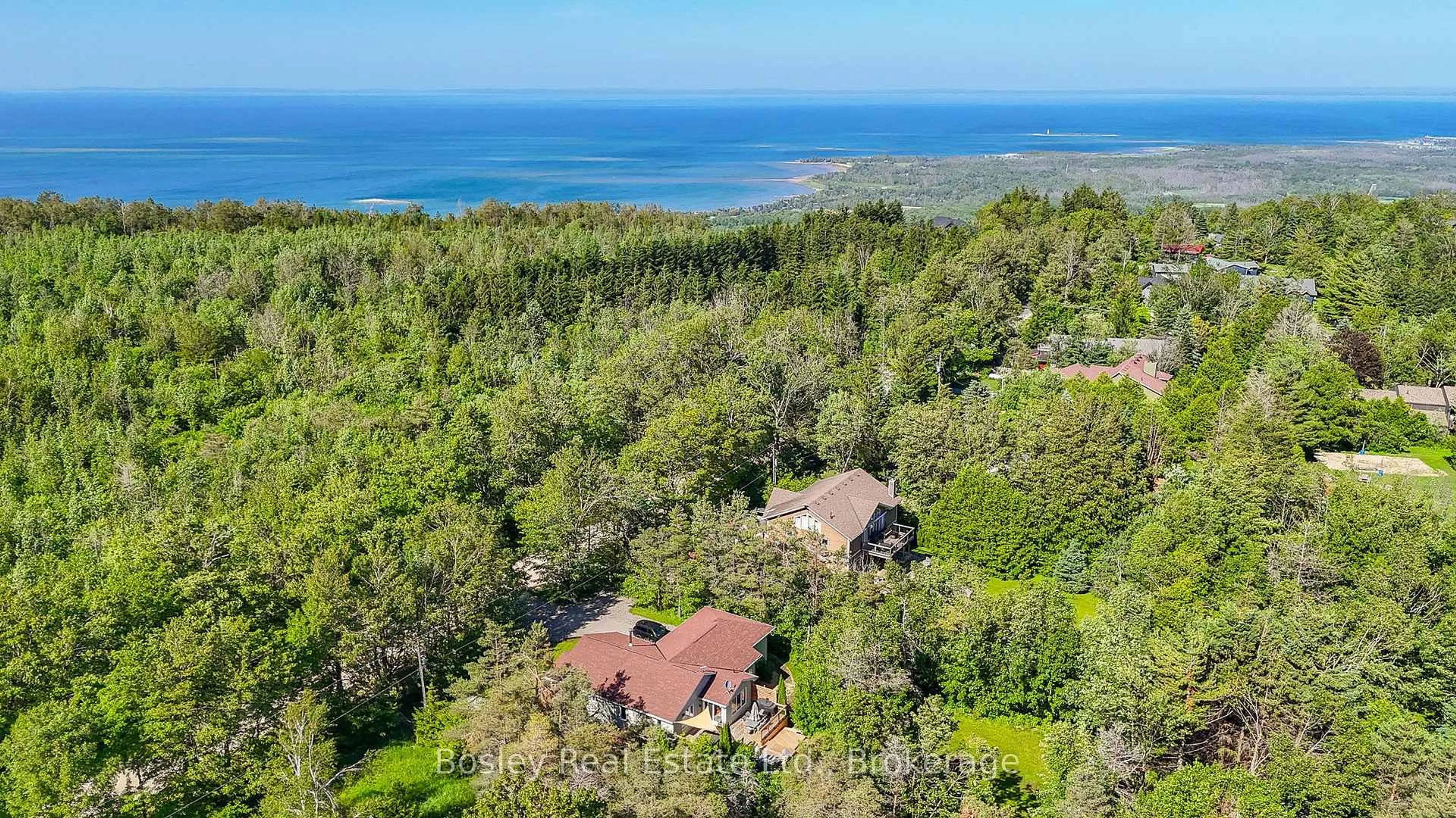 A pic from outside/outdoor area/front of a property/back of a property/a pic from drone, water/lake/river/ocean view for 136 Maple Lane, Blue Mountains Ontario N0H 2E0