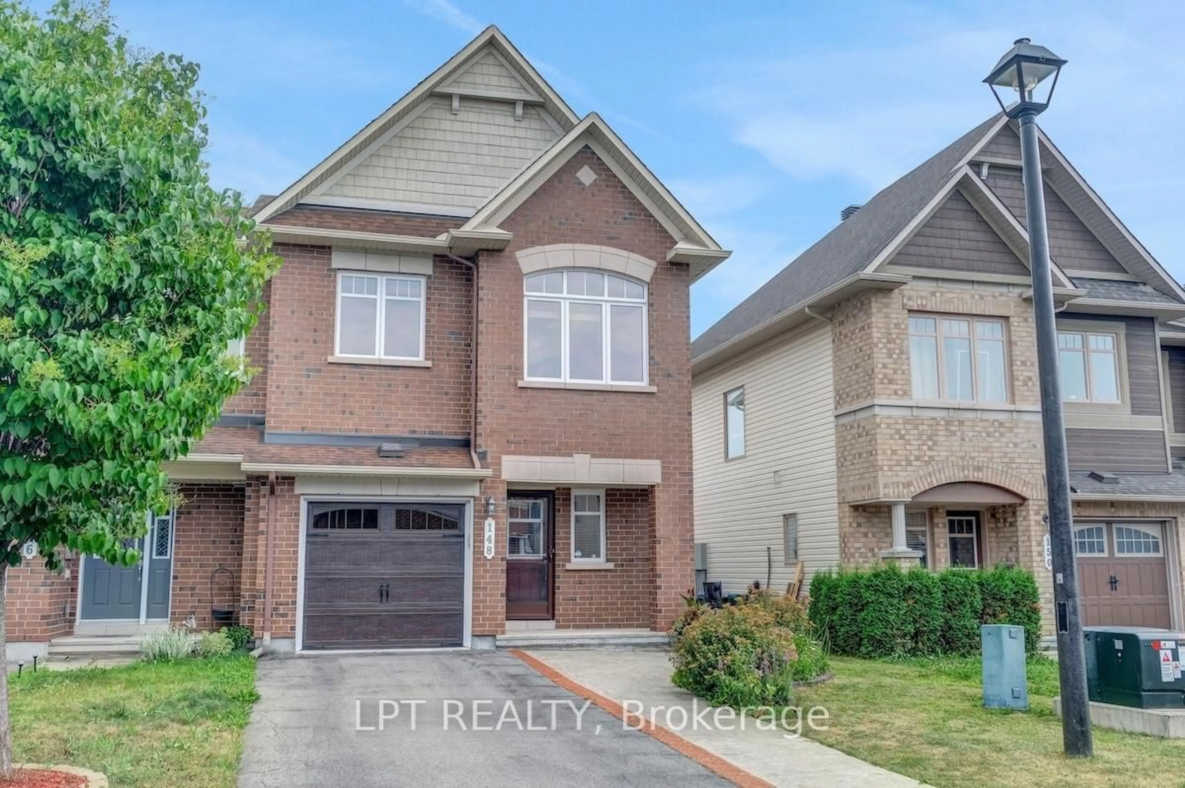 Home with brick exterior material, street for 148 Waterfern Way, Ottawa Ontario K4A 0T4