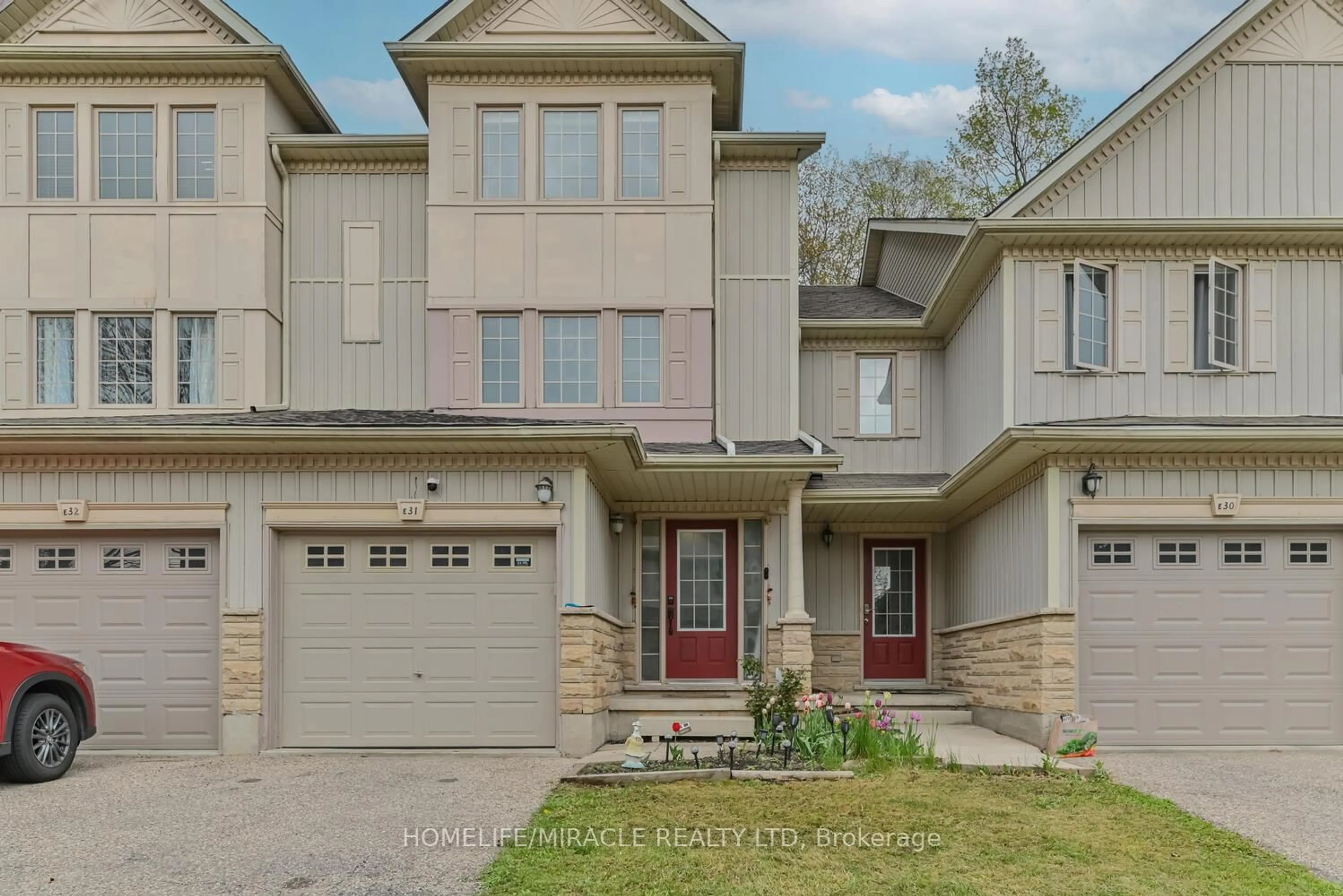 Home with brick exterior material, street for 110 Activa Ave #E-31, Kitchener Ontario N2E 4K4