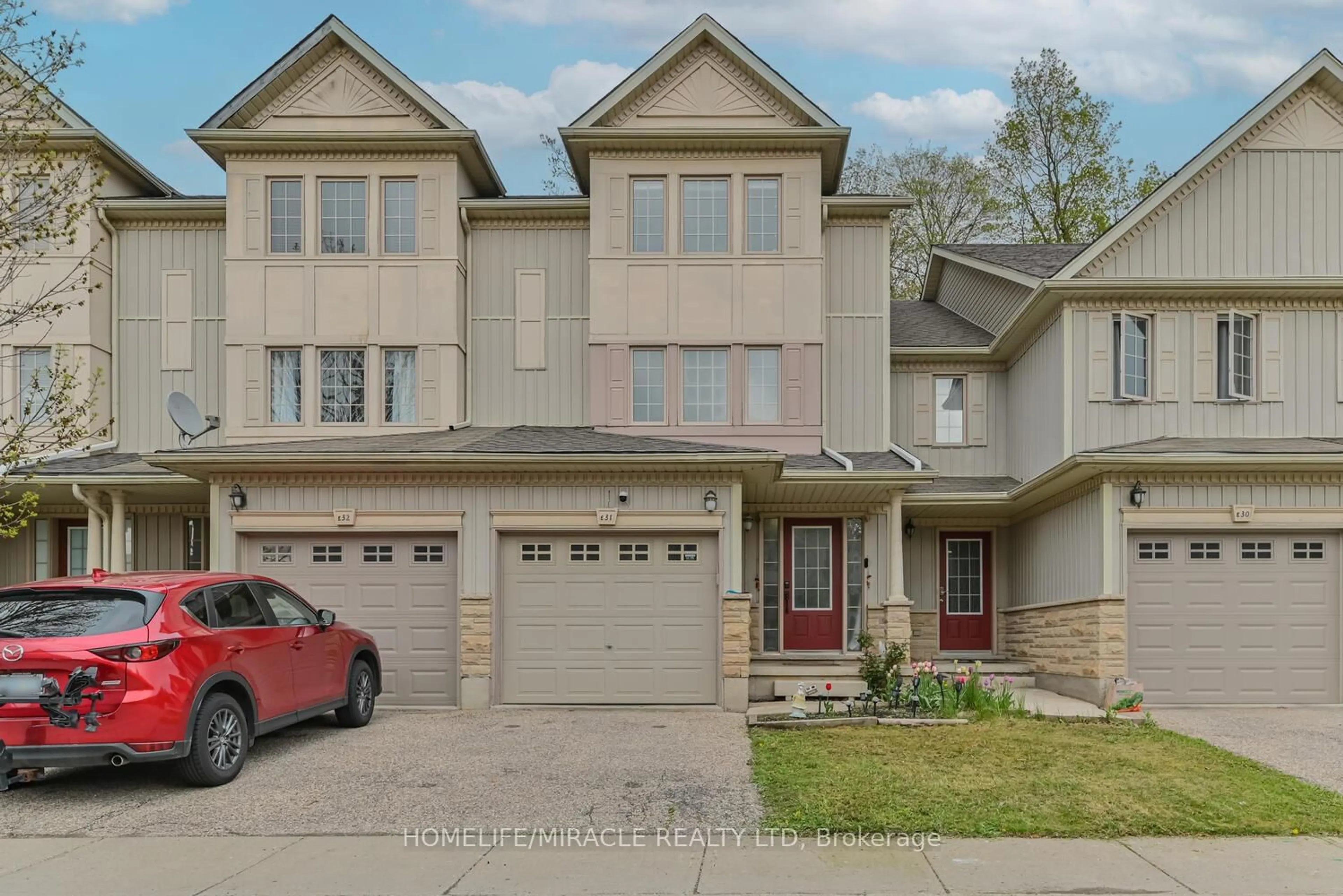 Home with brick exterior material, street for 110 Activa Ave #E-31, Kitchener Ontario N2E 4K4
