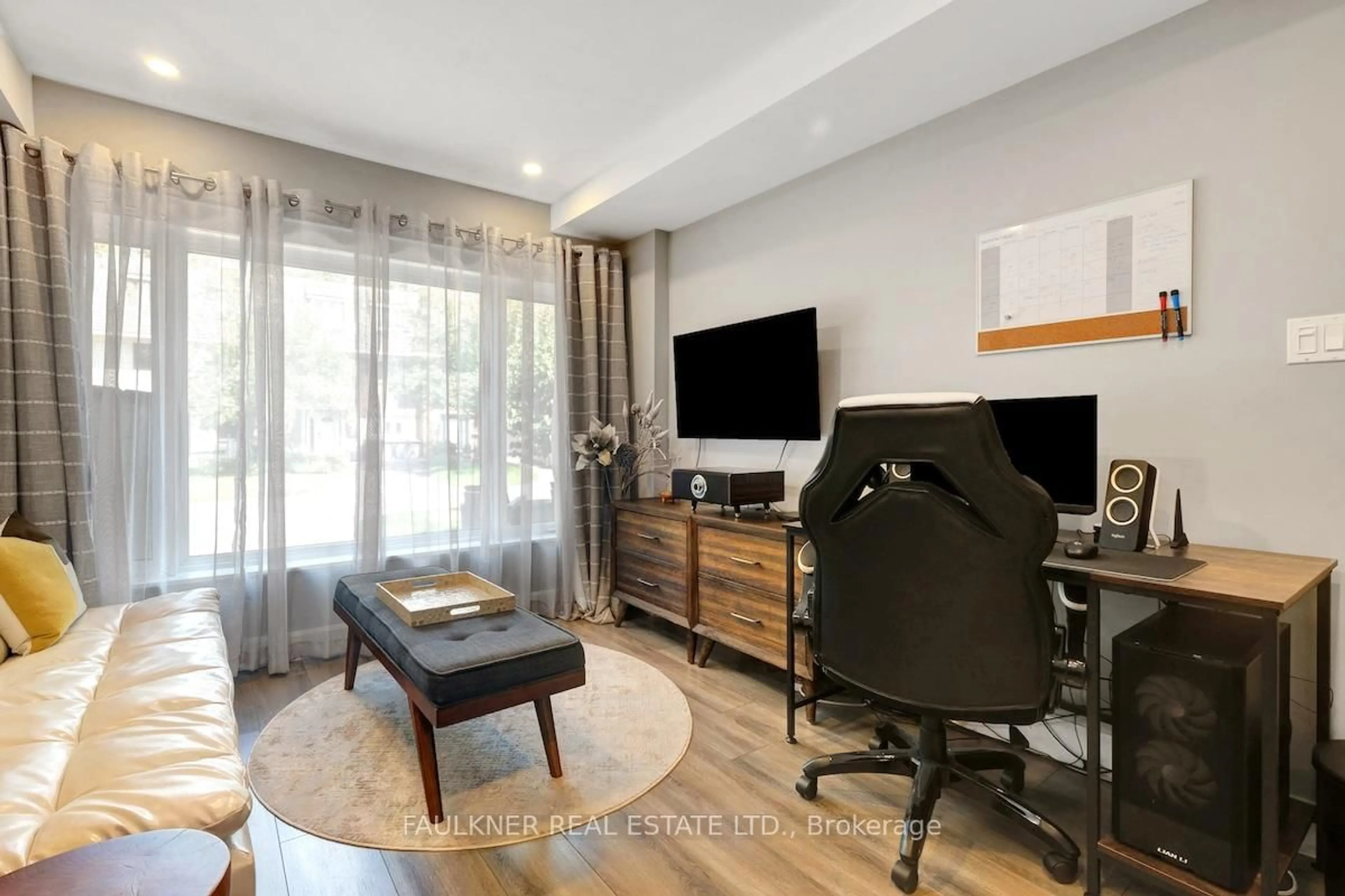 Living room with furniture, wood/laminate floor for 38 Marco Lane, Ottawa Ontario K1S 5A2