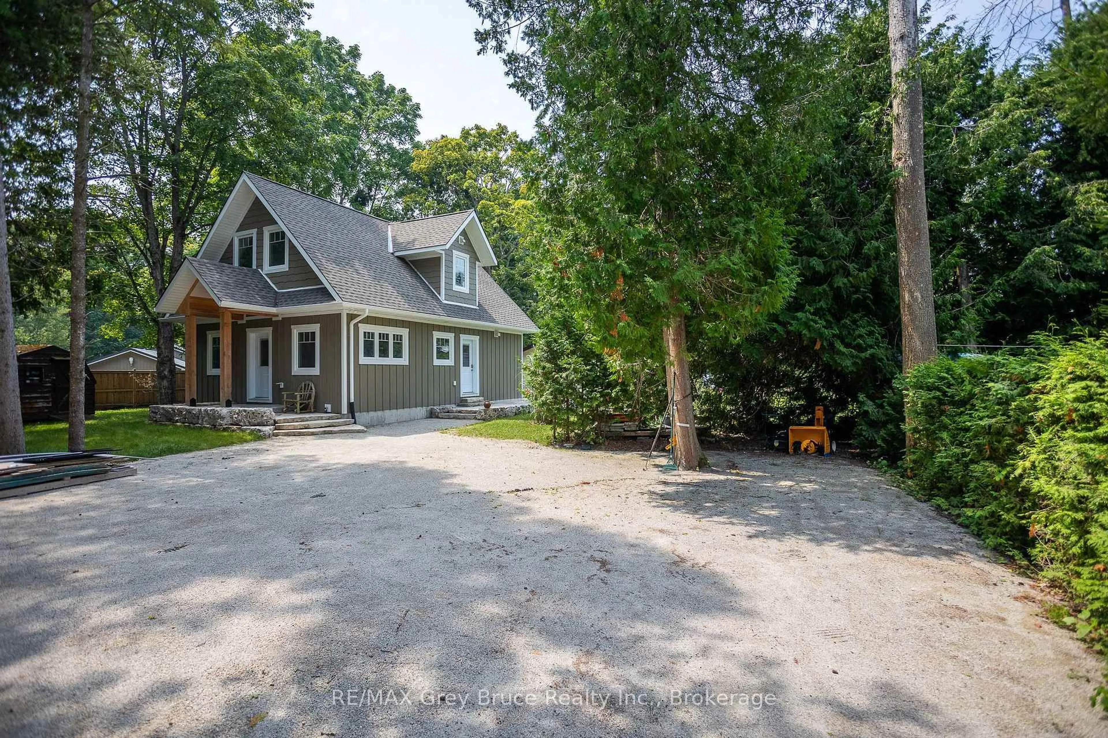 A pic from outside/outdoor area/front of a property/back of a property/a pic from drone, street for 457 Huron Rd Rd, South Bruce Peninsula Ontario N0H 2T0