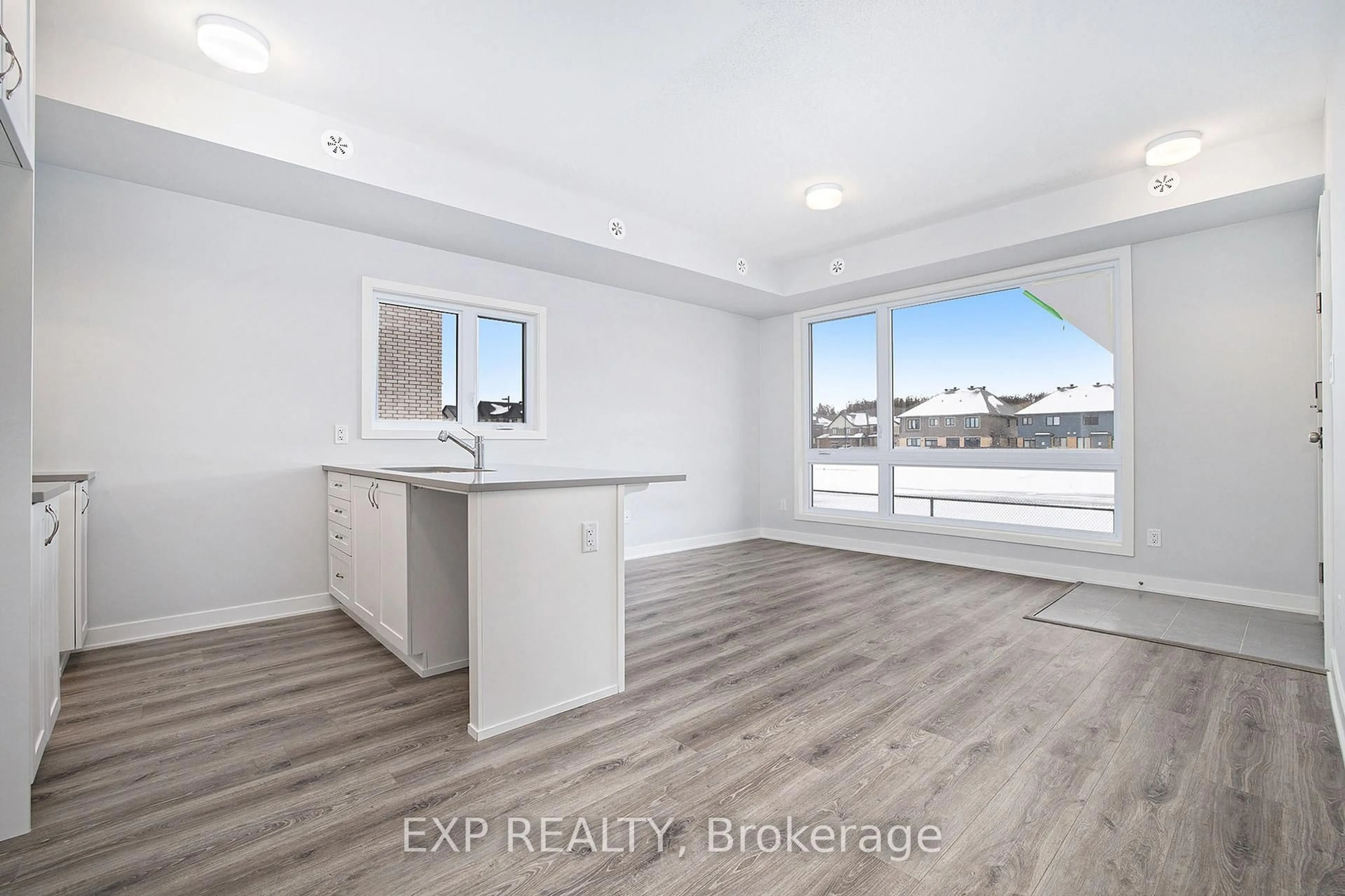 Open concept kitchen, wood/laminate floor for 722 MISHI Private, Ottawa Ontario K1K 0P2