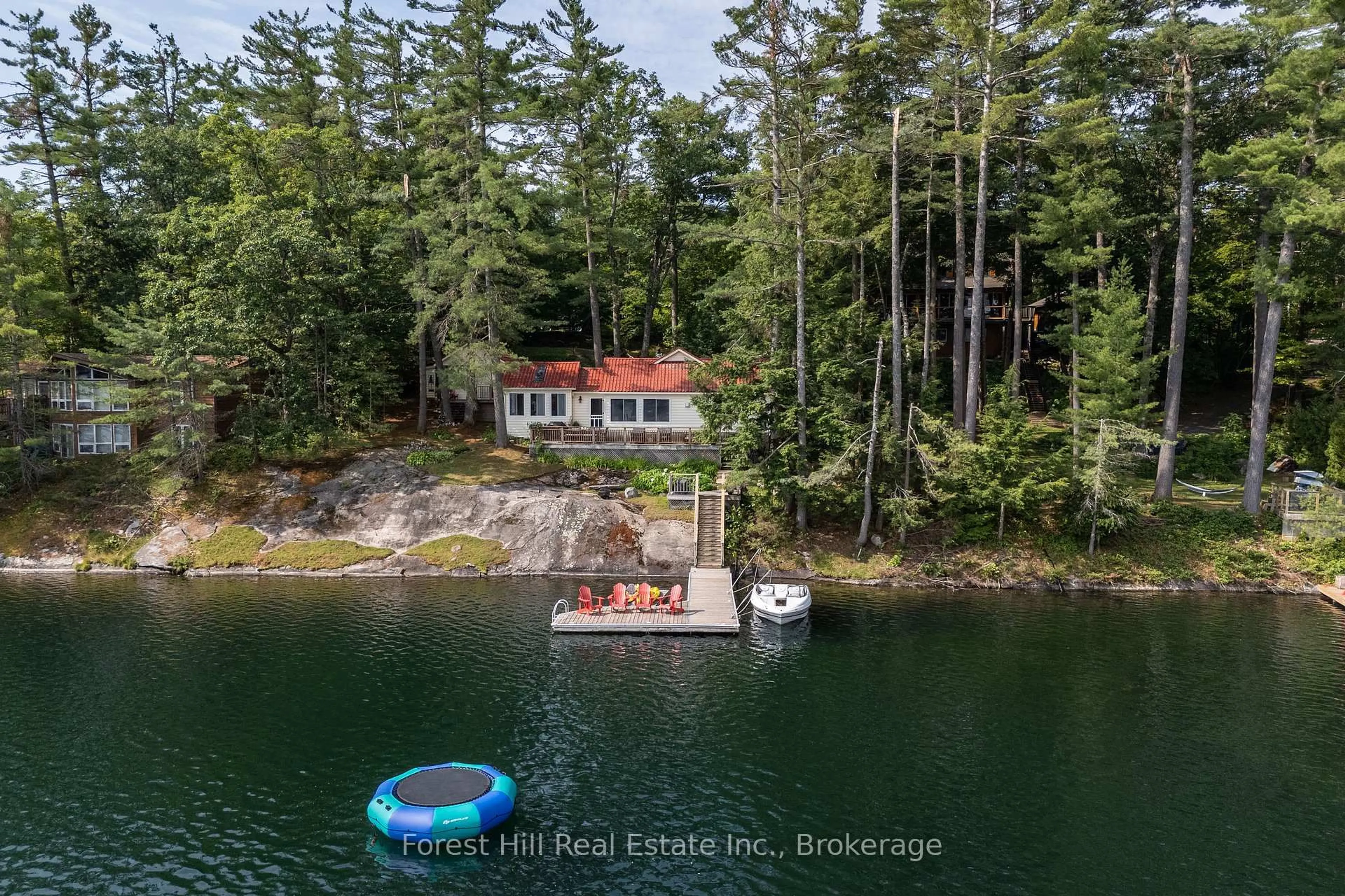 A pic from outside/outdoor area/front of a property/back of a property/a pic from drone, water/lake/river/ocean view for 1029 Ridge Rd, Muskoka Lakes Ontario P0C 1M0