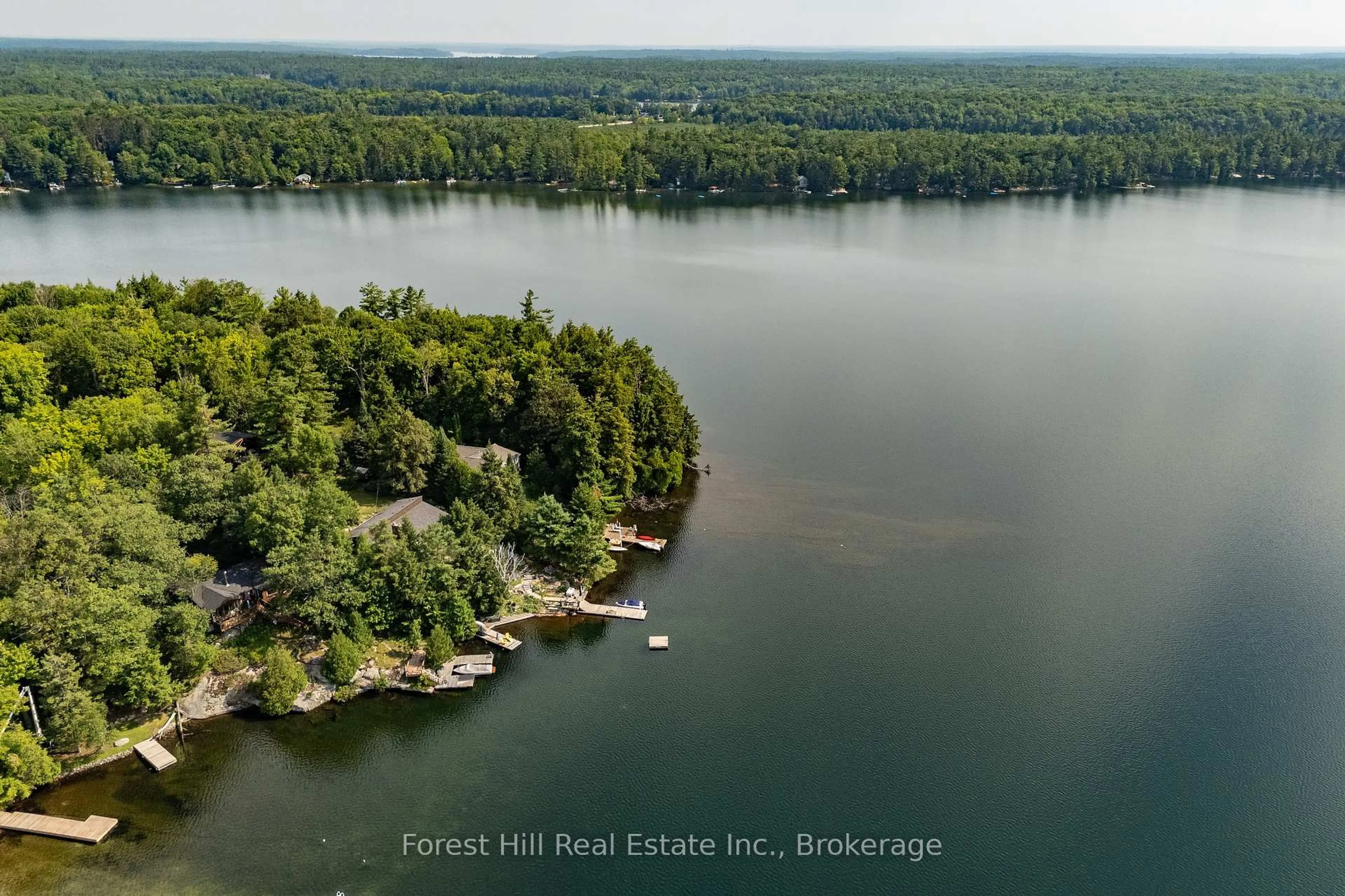 A pic from outside/outdoor area/front of a property/back of a property/a pic from drone, water/lake/river/ocean view for 1029 Ridge Rd, Muskoka Lakes Ontario P0C 1M0