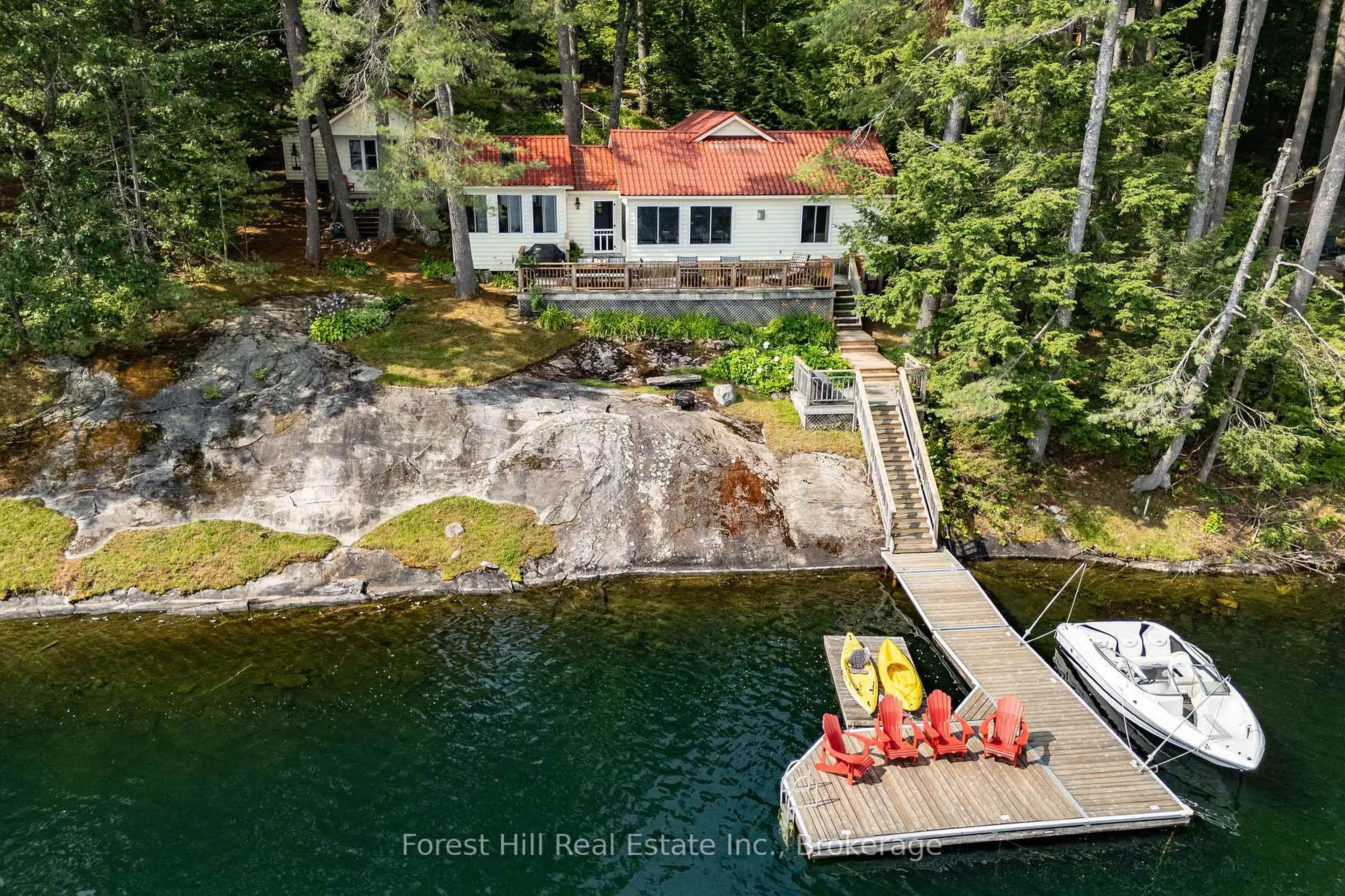 A pic from outside/outdoor area/front of a property/back of a property/a pic from drone, water/lake/river/ocean view for 1029 Ridge Rd, Muskoka Lakes Ontario P0C 1M0
