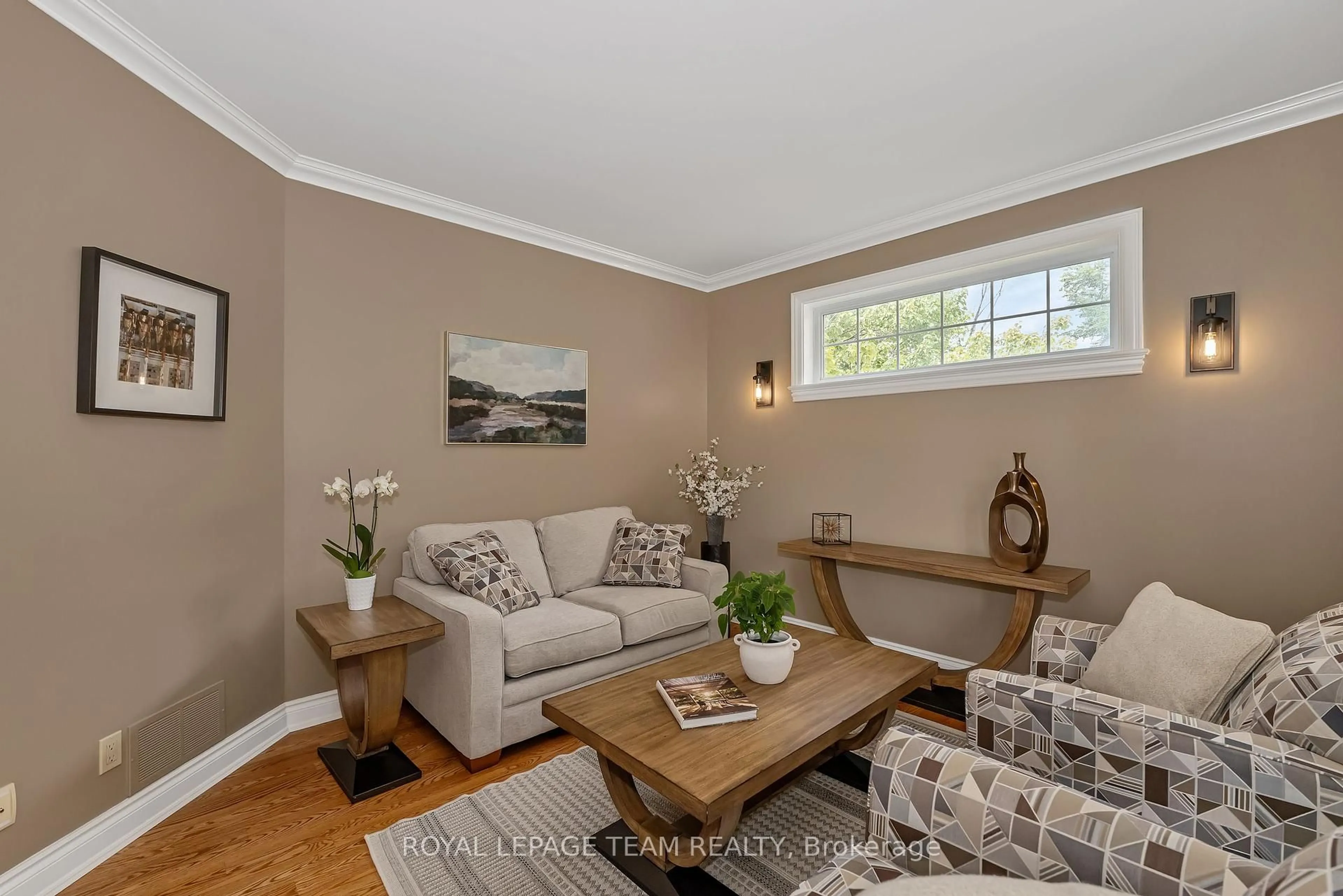 Living room with furniture, wood/laminate floor for 49 Shining Star Circ, Ottawa Ontario K2S 2B4