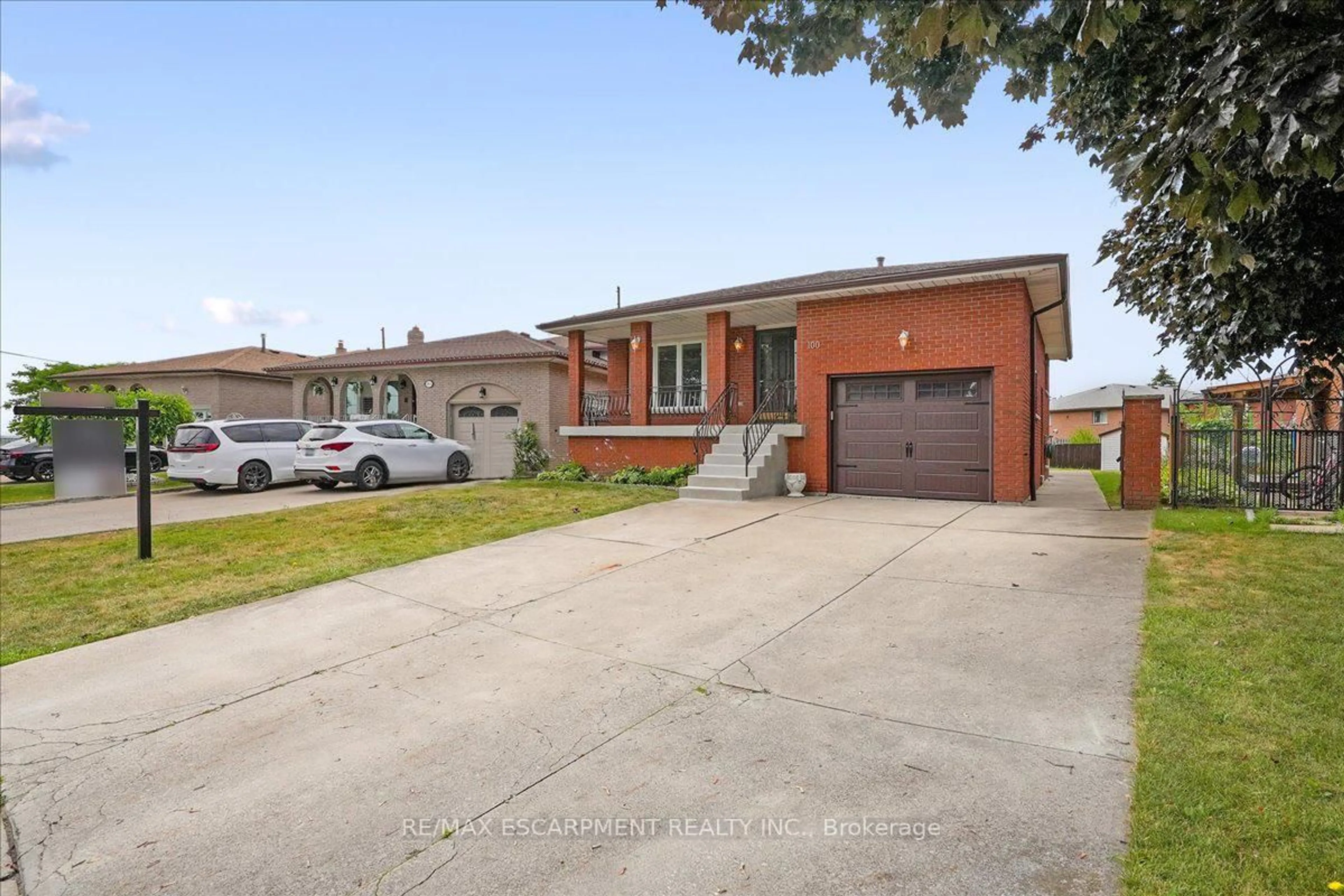Home with brick exterior material, street for 100 Taymall St, Hamilton Ontario L8W 1Z4