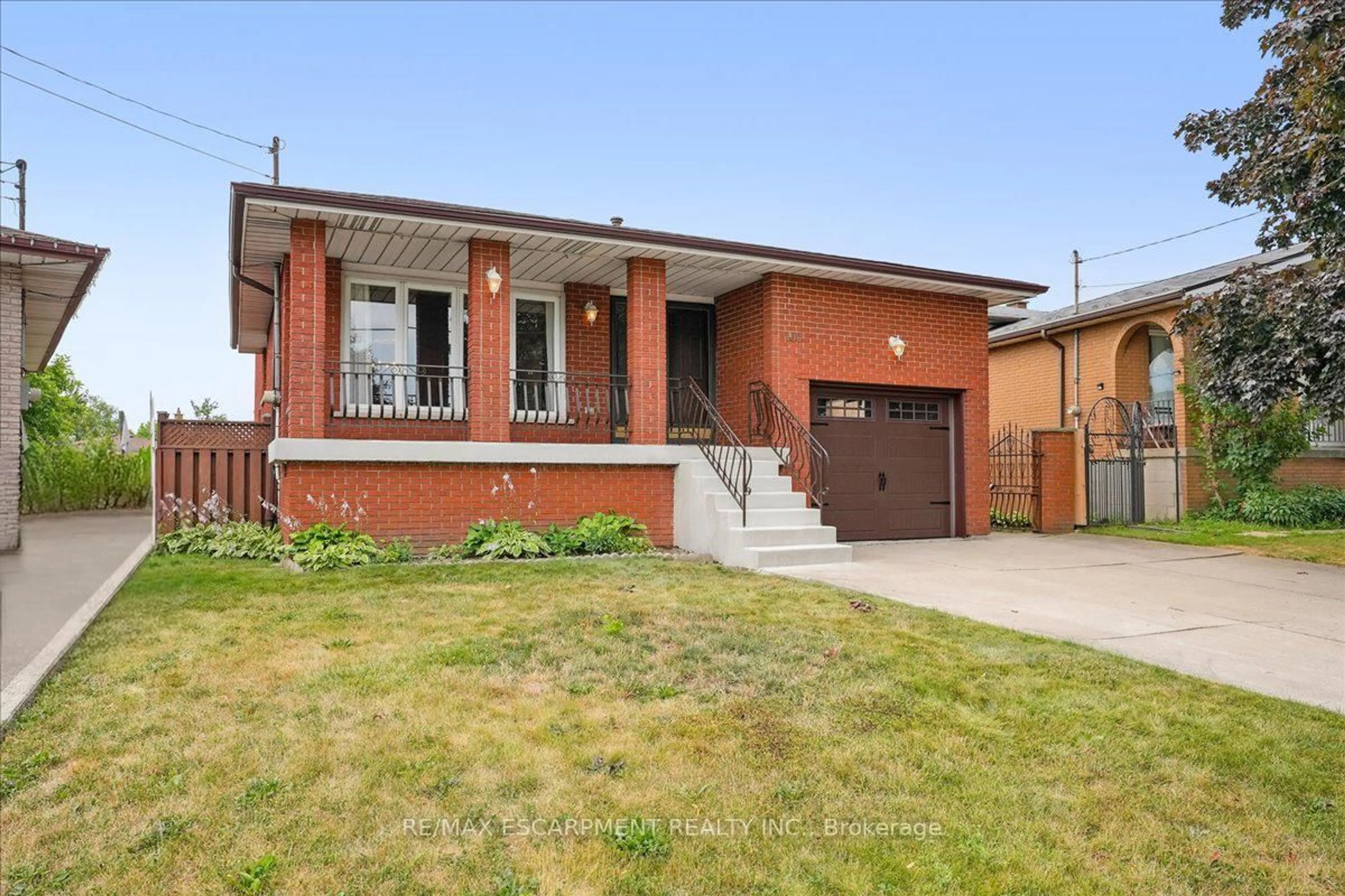 Home with brick exterior material, street for 100 Taymall St, Hamilton Ontario L8W 1Z4
