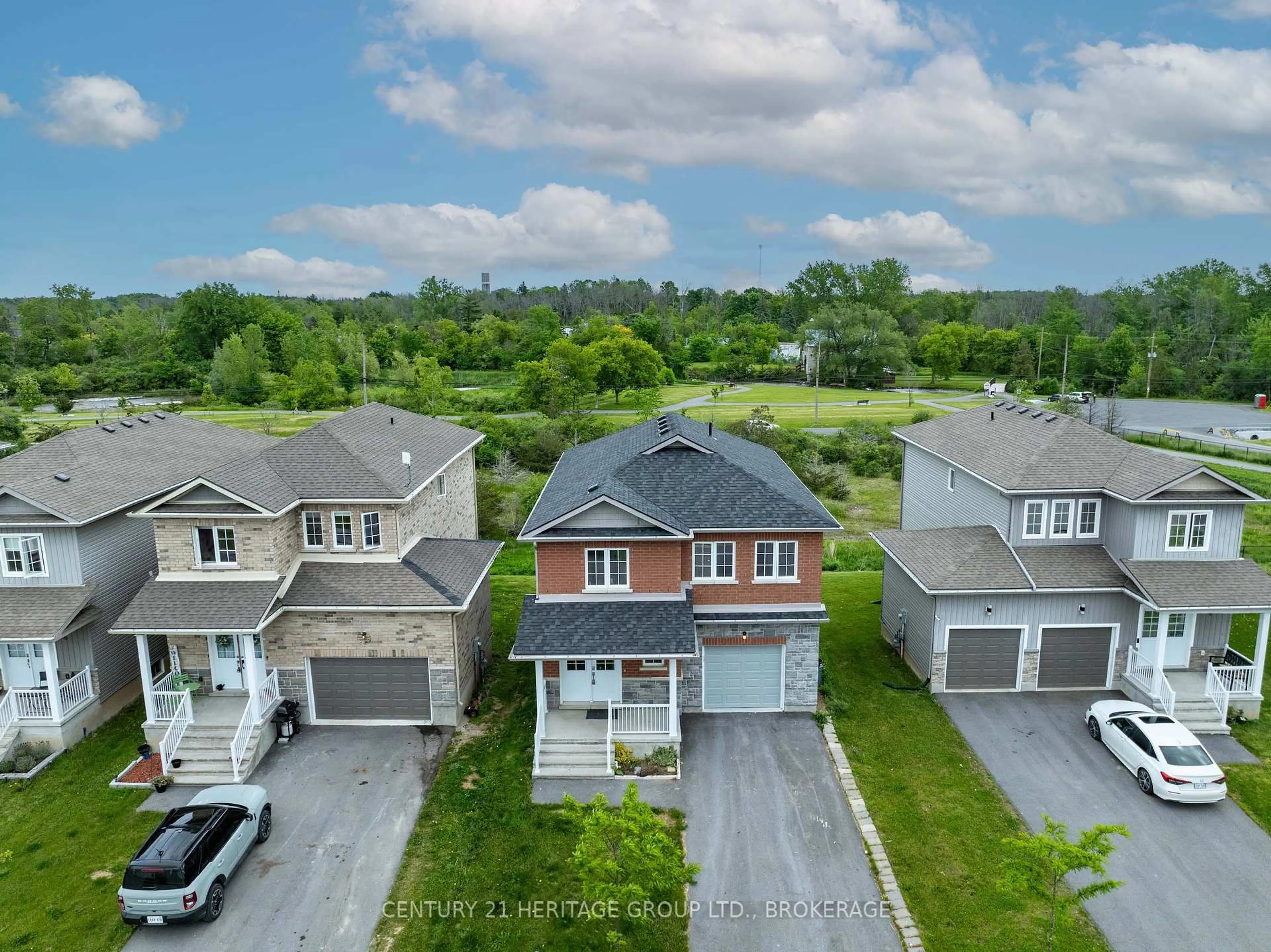 A pic from outside/outdoor area/front of a property/back of a property/a pic from drone, street for 104 Brennan Cres, Bissett Creek Ontario K0H 2H0