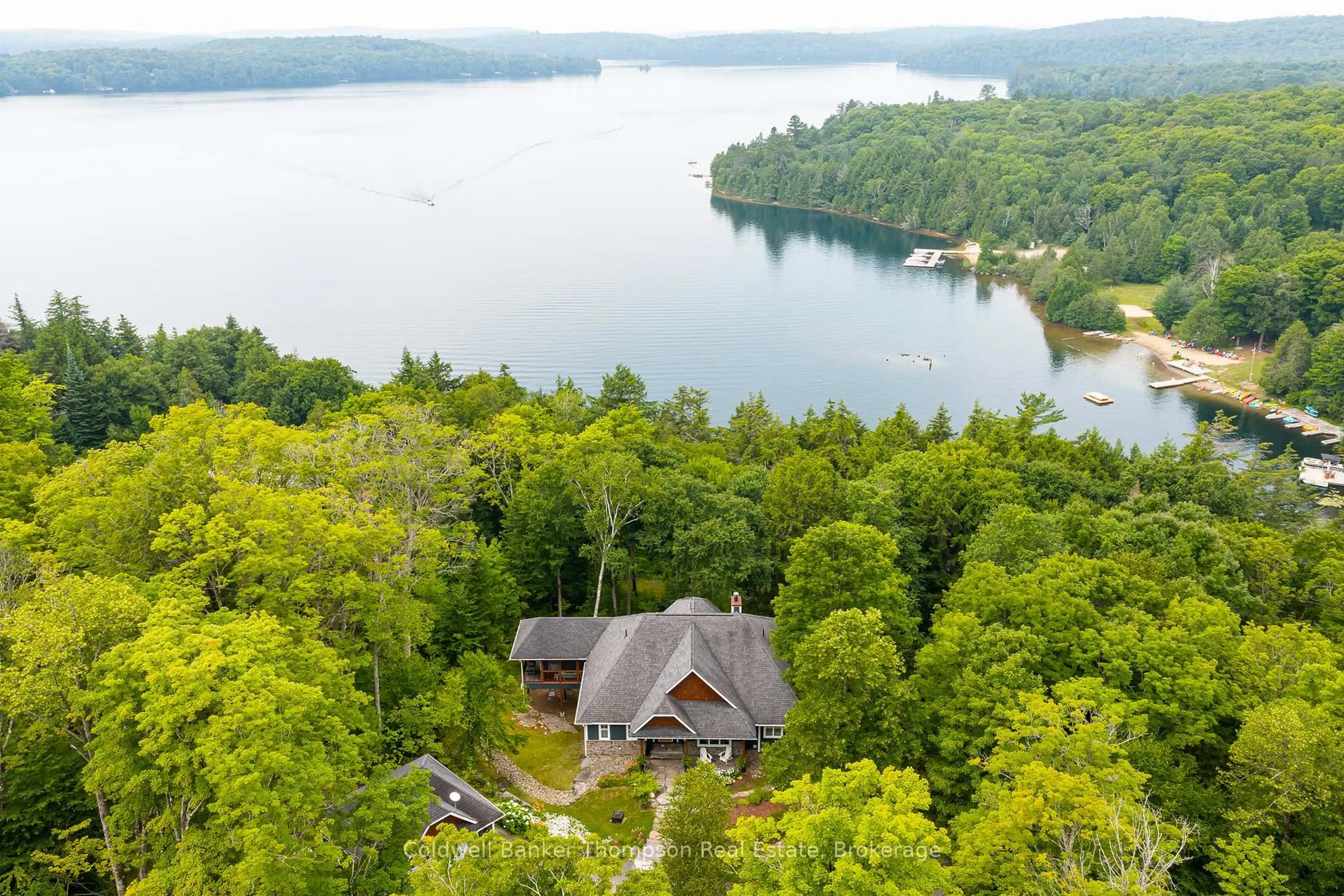 A pic from outside/outdoor area/front of a property/back of a property/a pic from drone, water/lake/river/ocean view for 1030 Hart Lane, Lake of Bays Ontario P1H 2J6