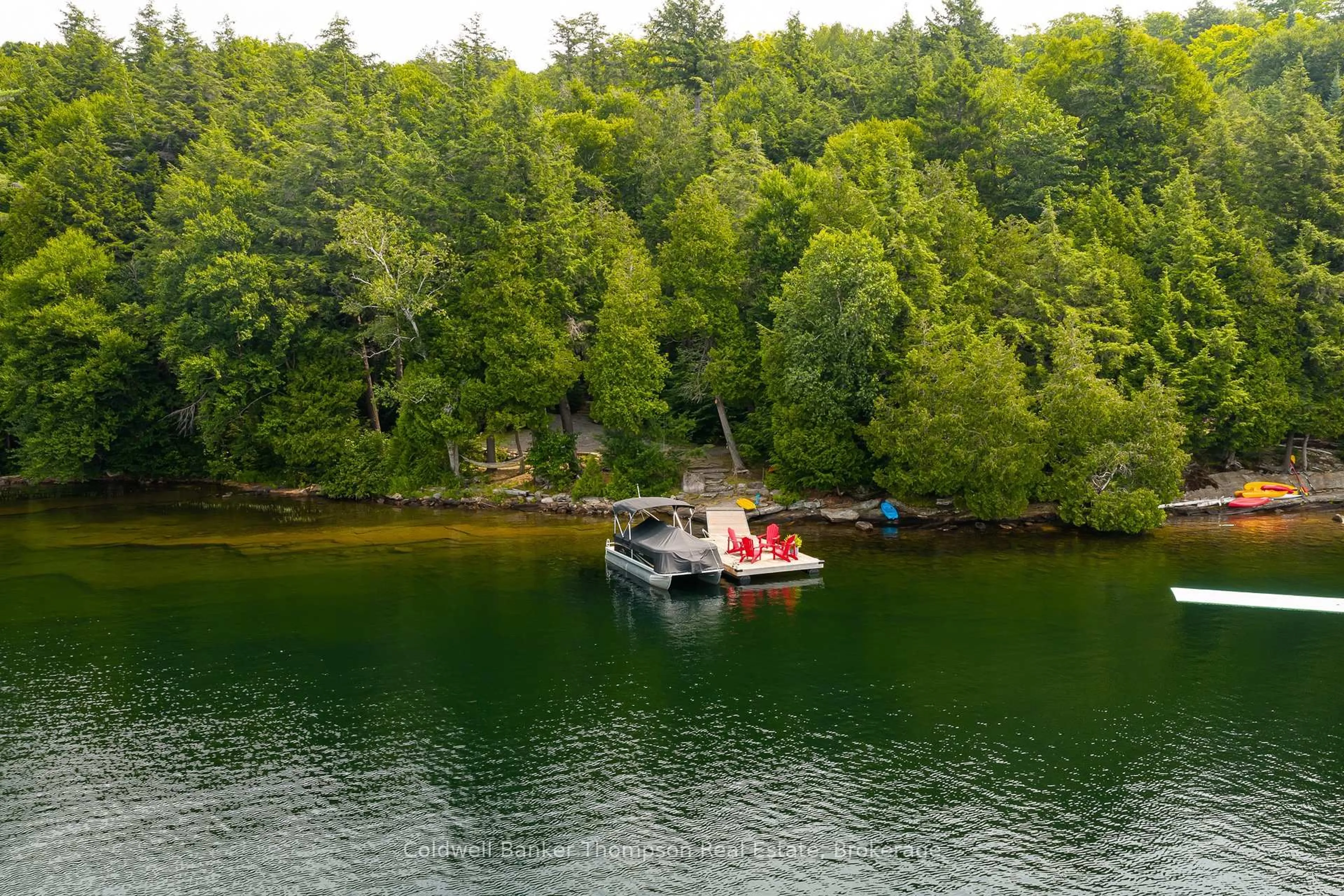 A pic from outside/outdoor area/front of a property/back of a property/a pic from drone, water/lake/river/ocean view for 1030 Hart Lane, Lake of Bays Ontario P1H 2J6