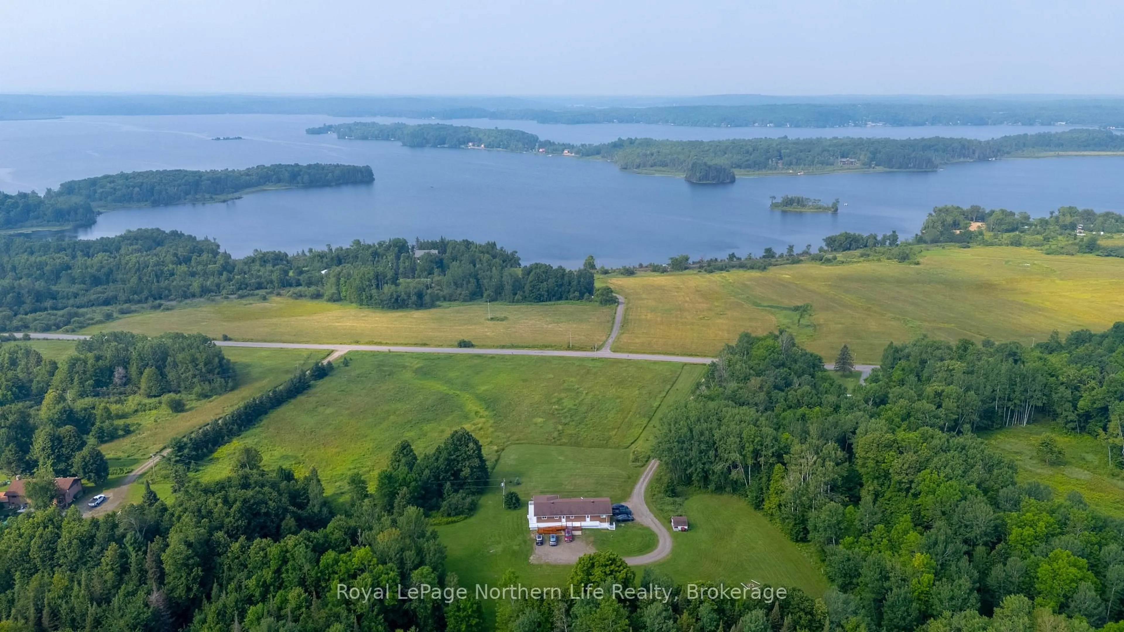 A pic from outside/outdoor area/front of a property/back of a property/a pic from drone, water/lake/river/ocean view for 13 Sunnyside Rd, Bonfield Ontario P0H 1K0
