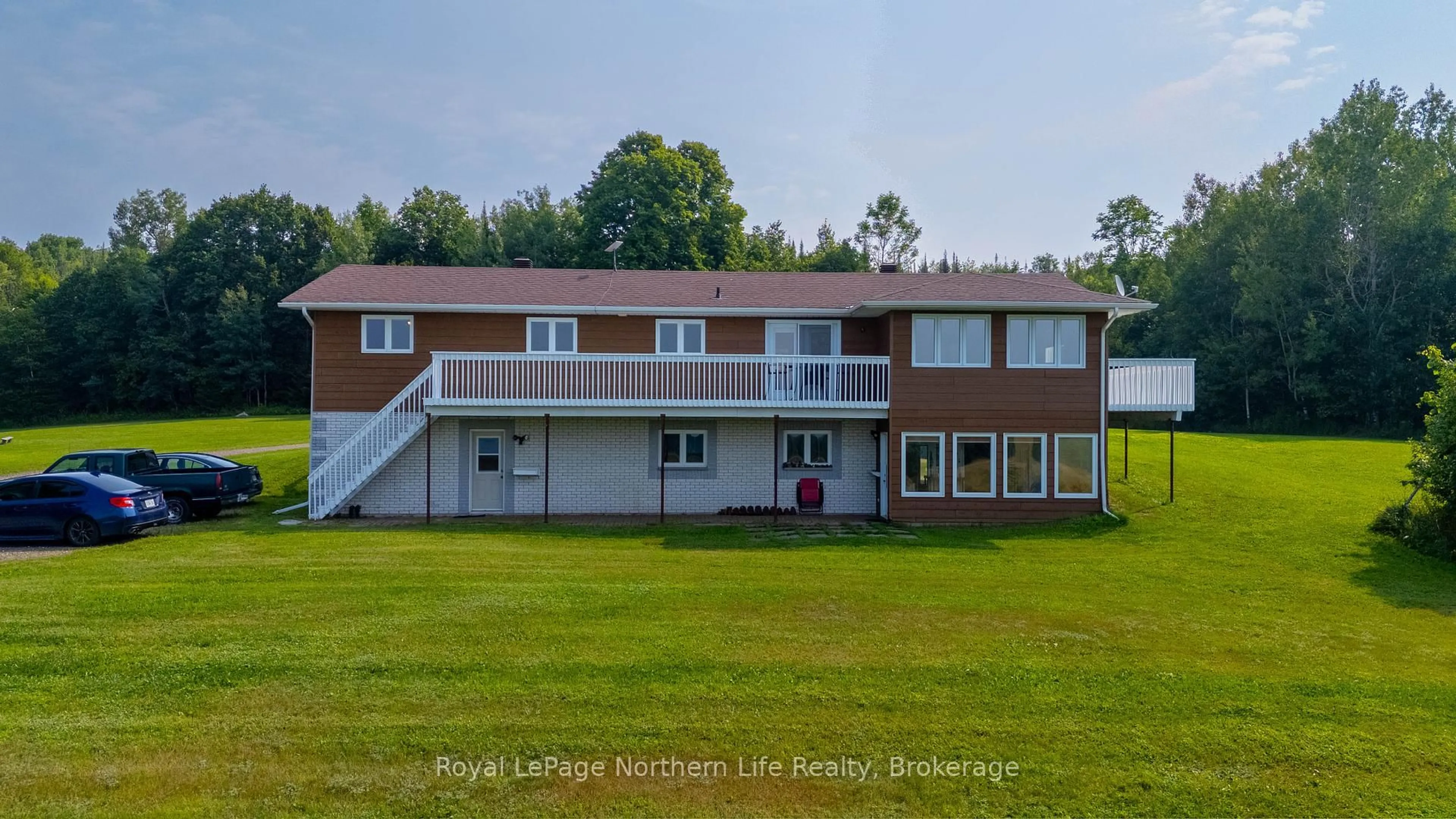 A pic from outside/outdoor area/front of a property/back of a property/a pic from drone, building for 13 Sunnyside Rd, Bonfield Ontario P0H 1K0